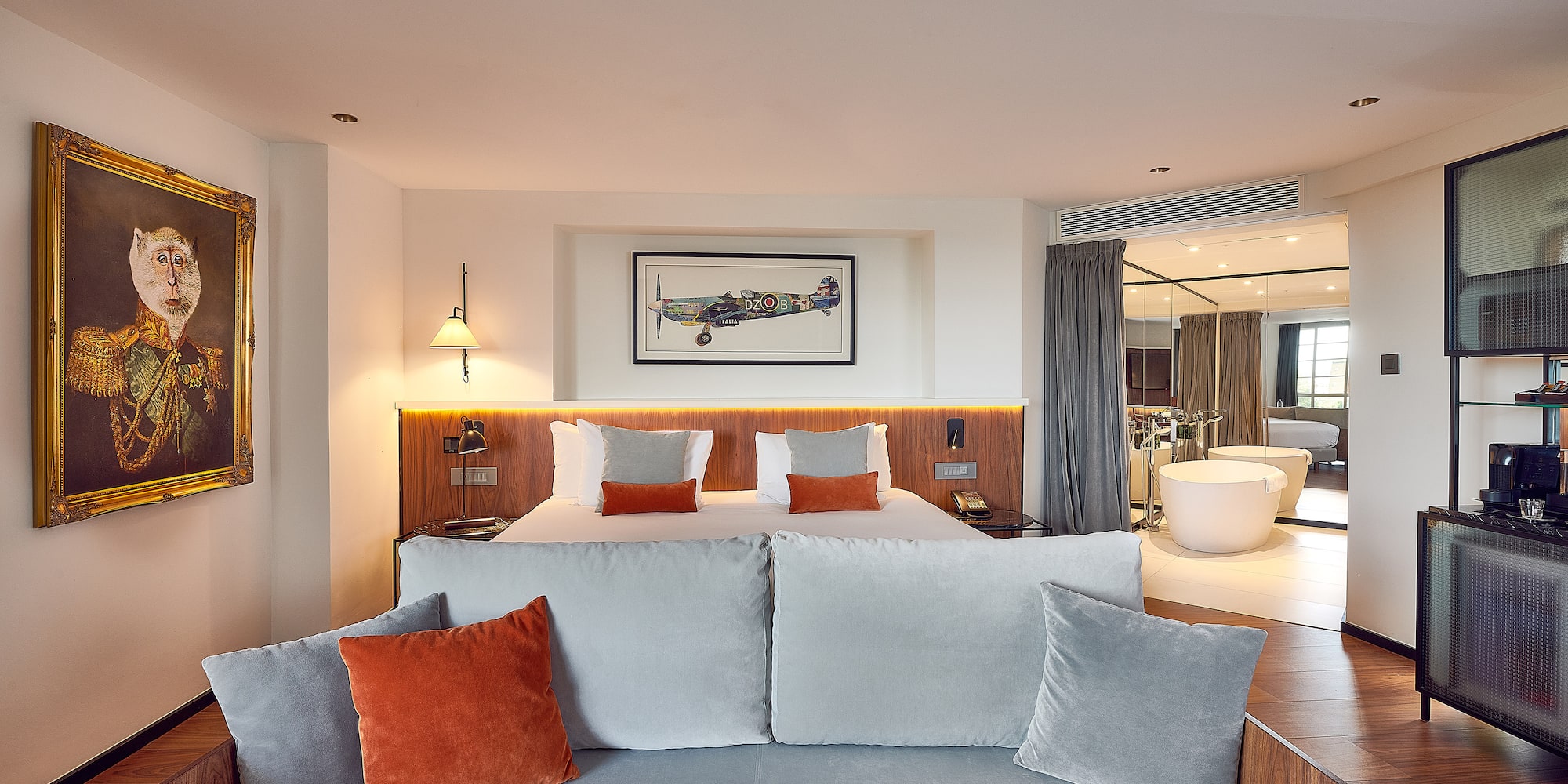 a room with a bed and a bathtub