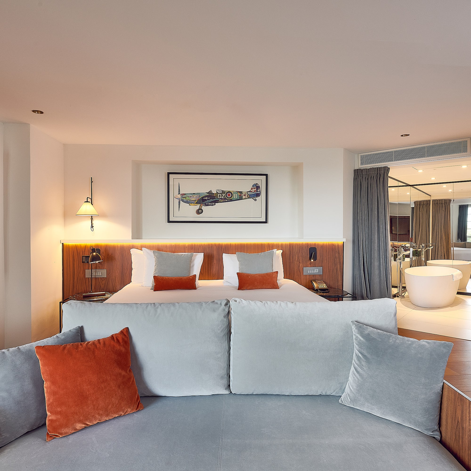 a room with a bed and a bathtub