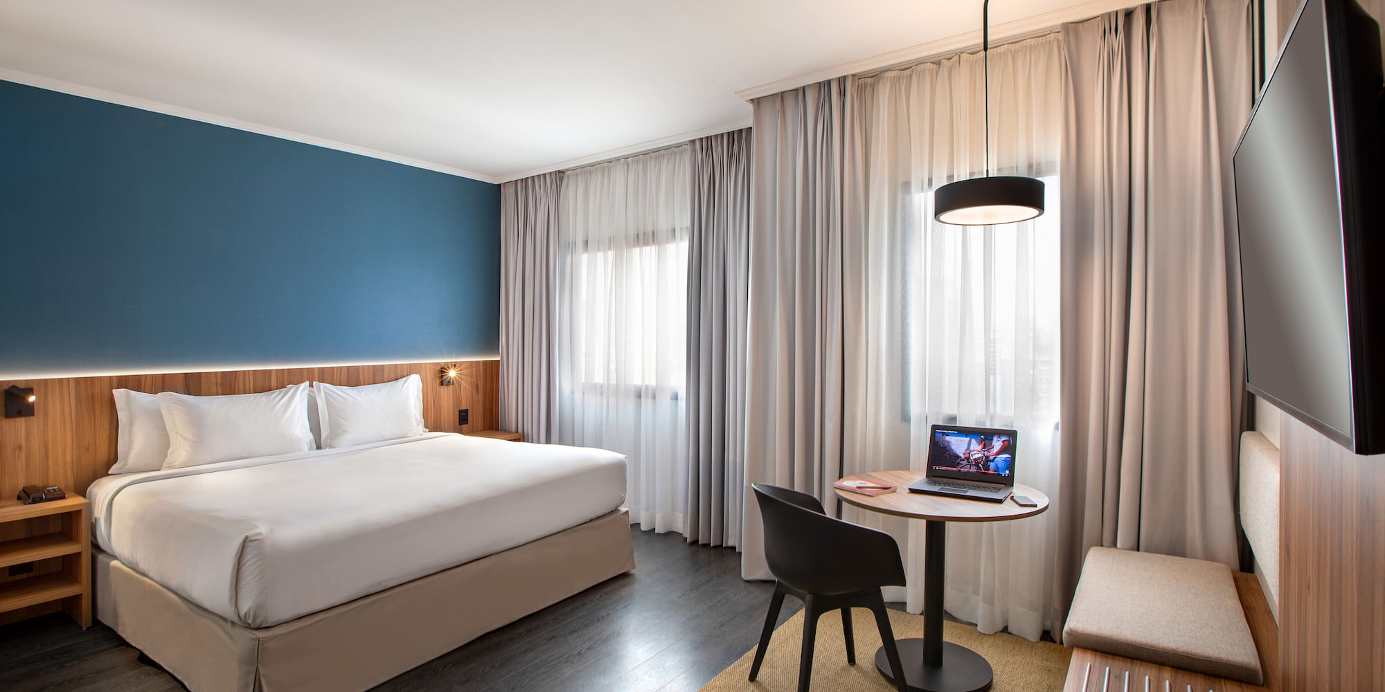 a room with a bed and a small table