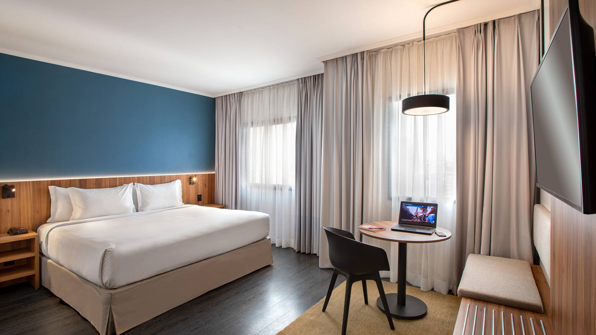 a room with a bed and a small table