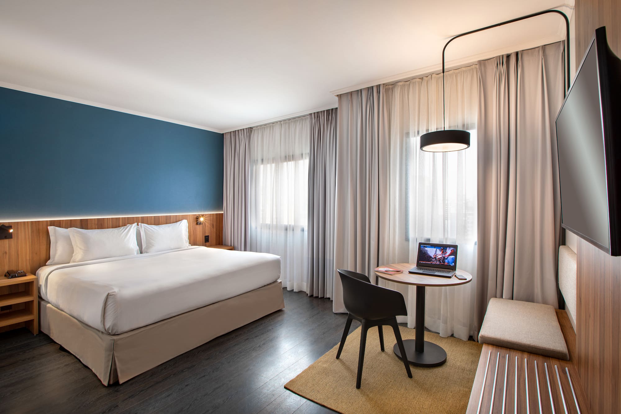 a room with a bed and a small table