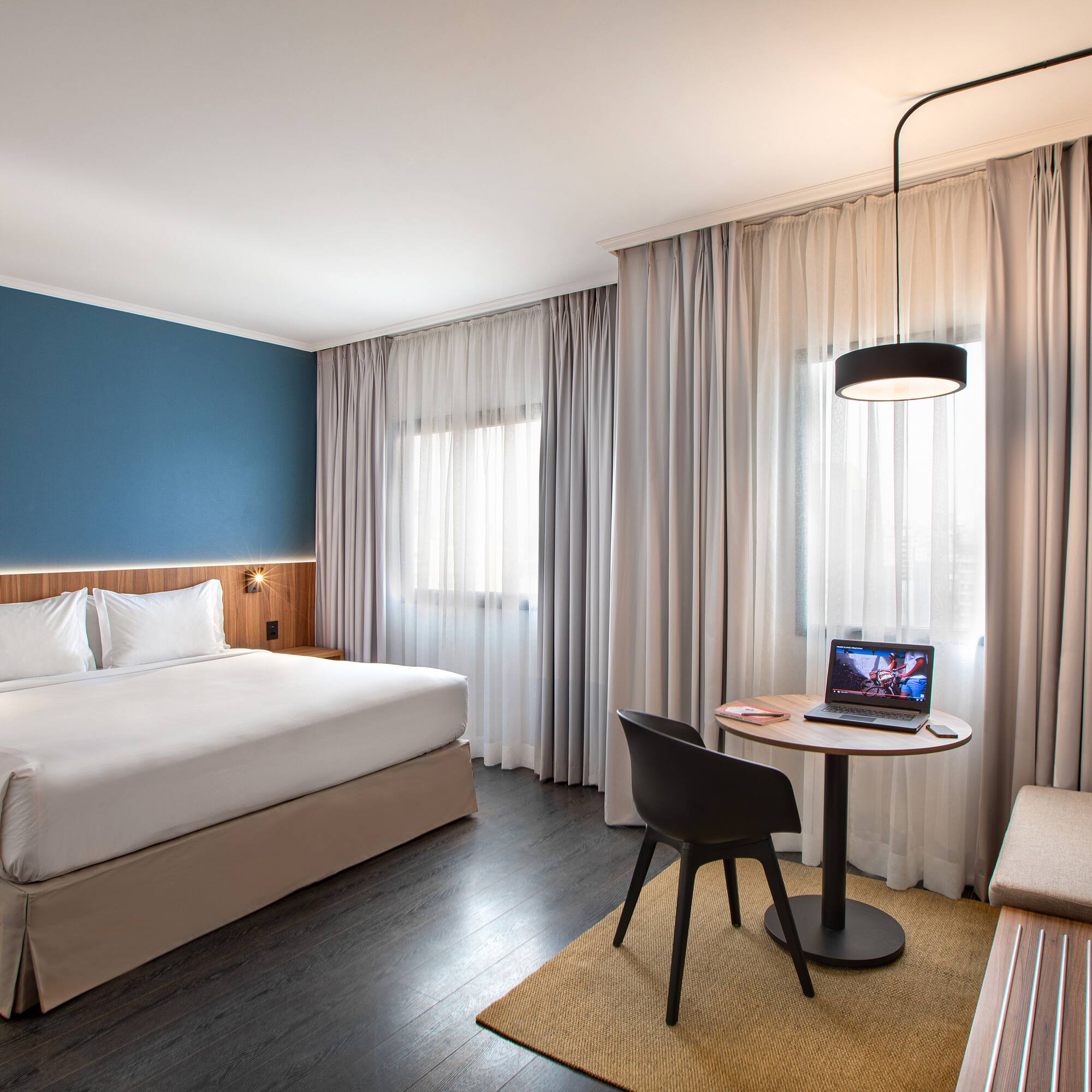 a room with a bed and a small table