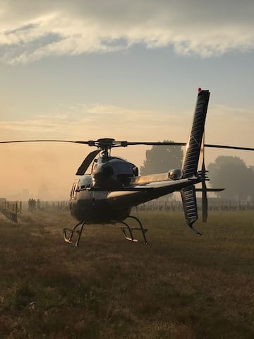 a helicopter on a grass field