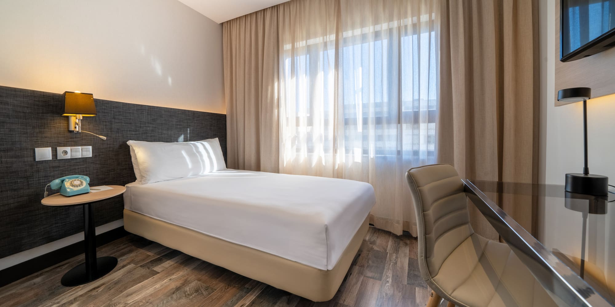 a room with a bed and a chair