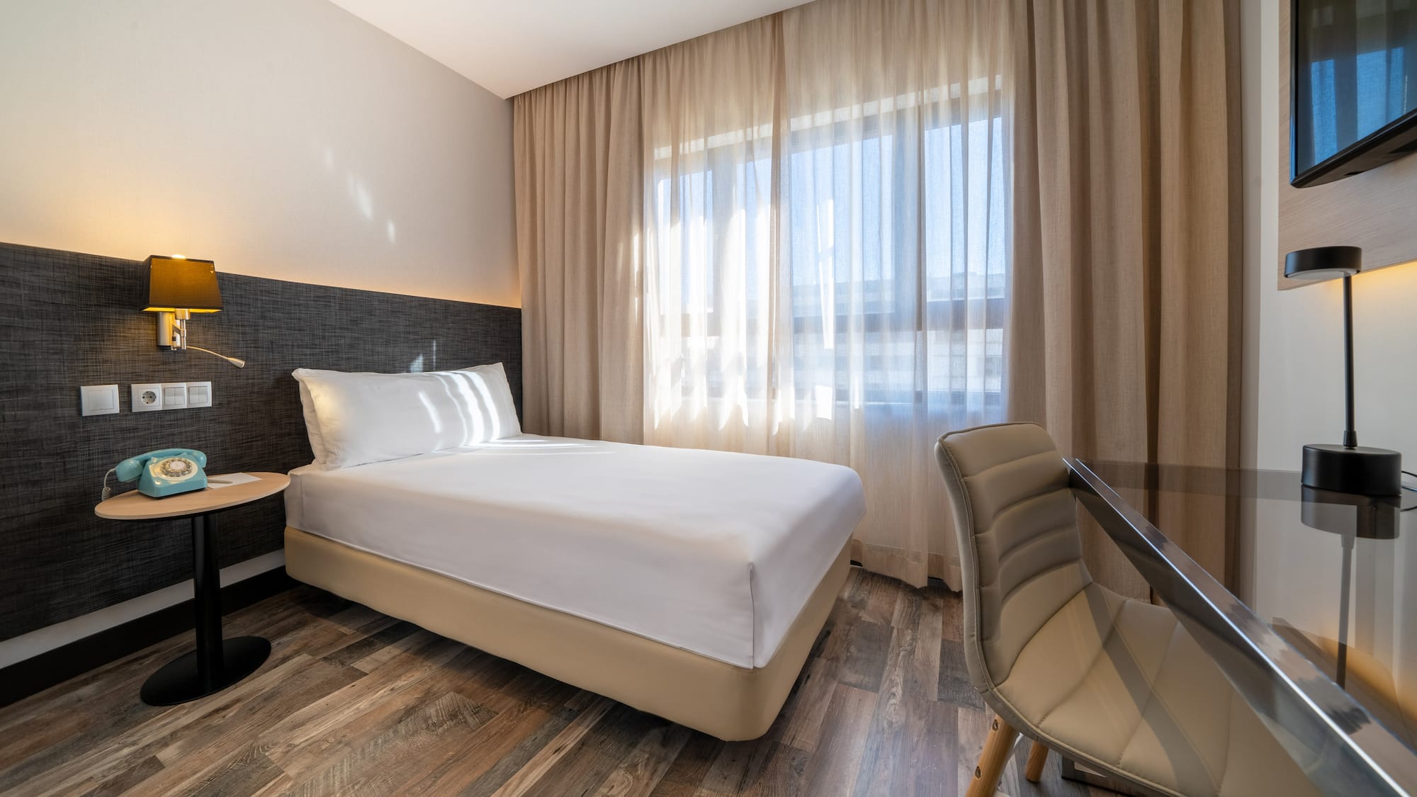 a room with a bed and a chair