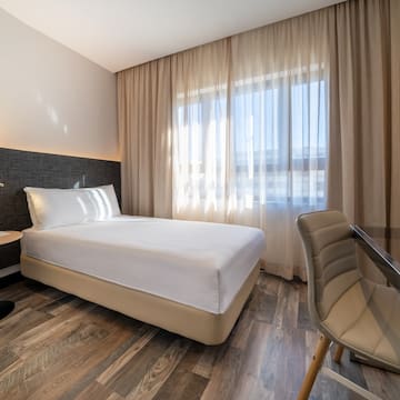 a room with a bed and a chair