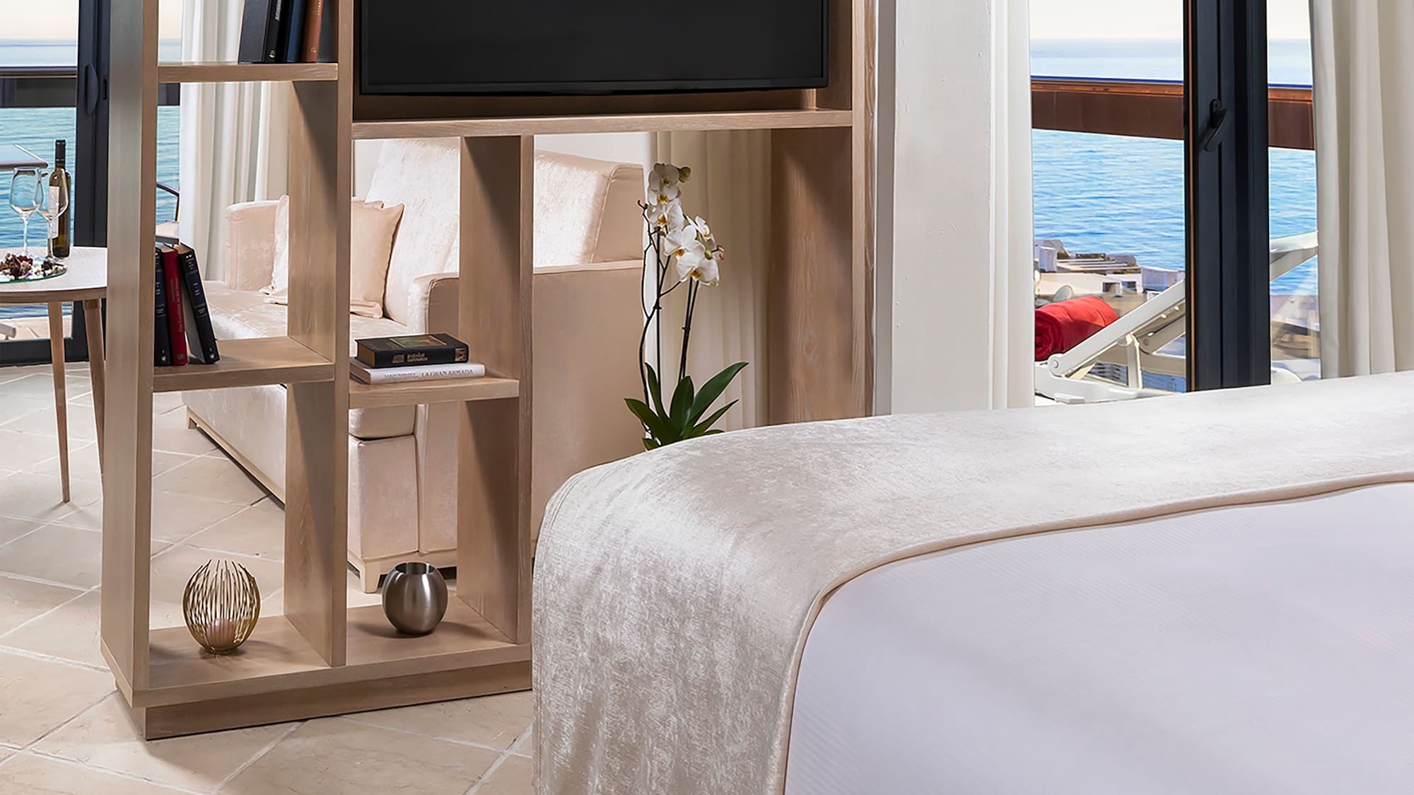 a room with a television and a bed