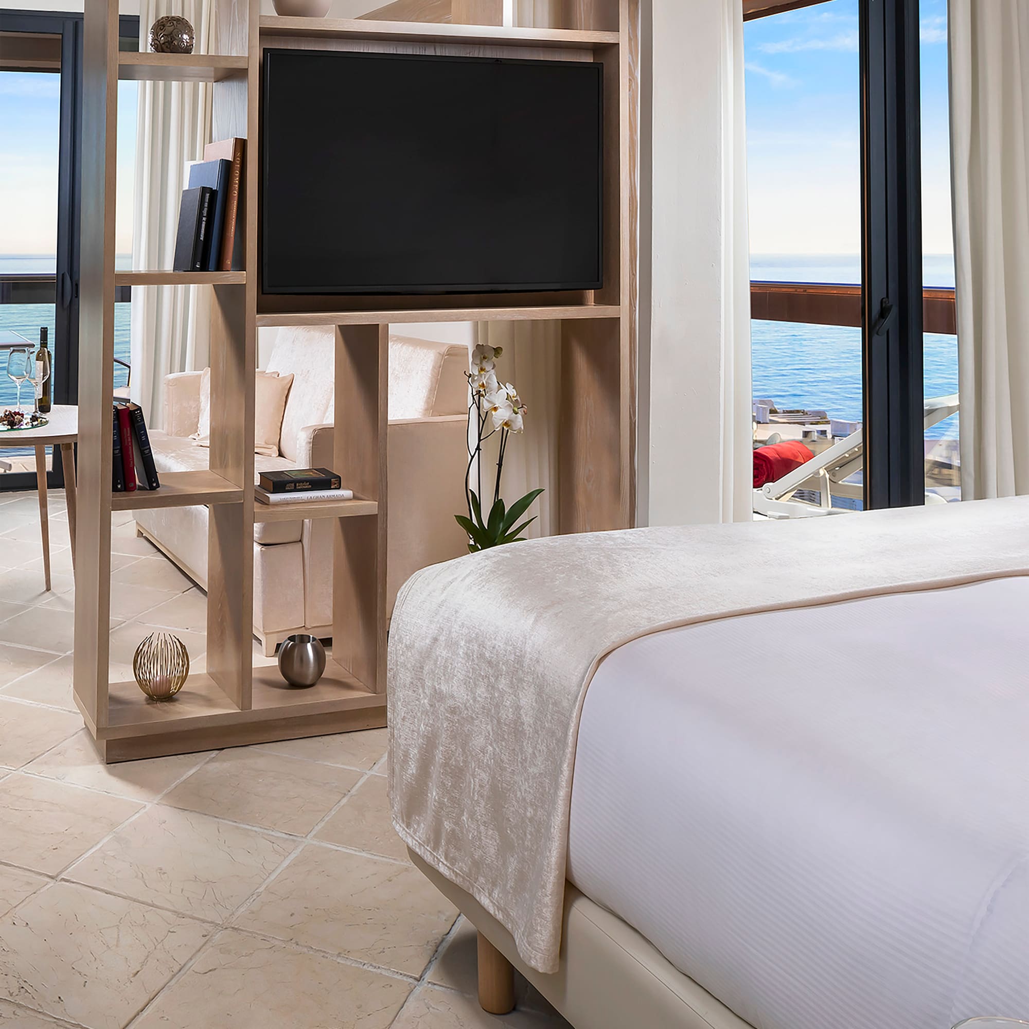 a room with a television and a bed