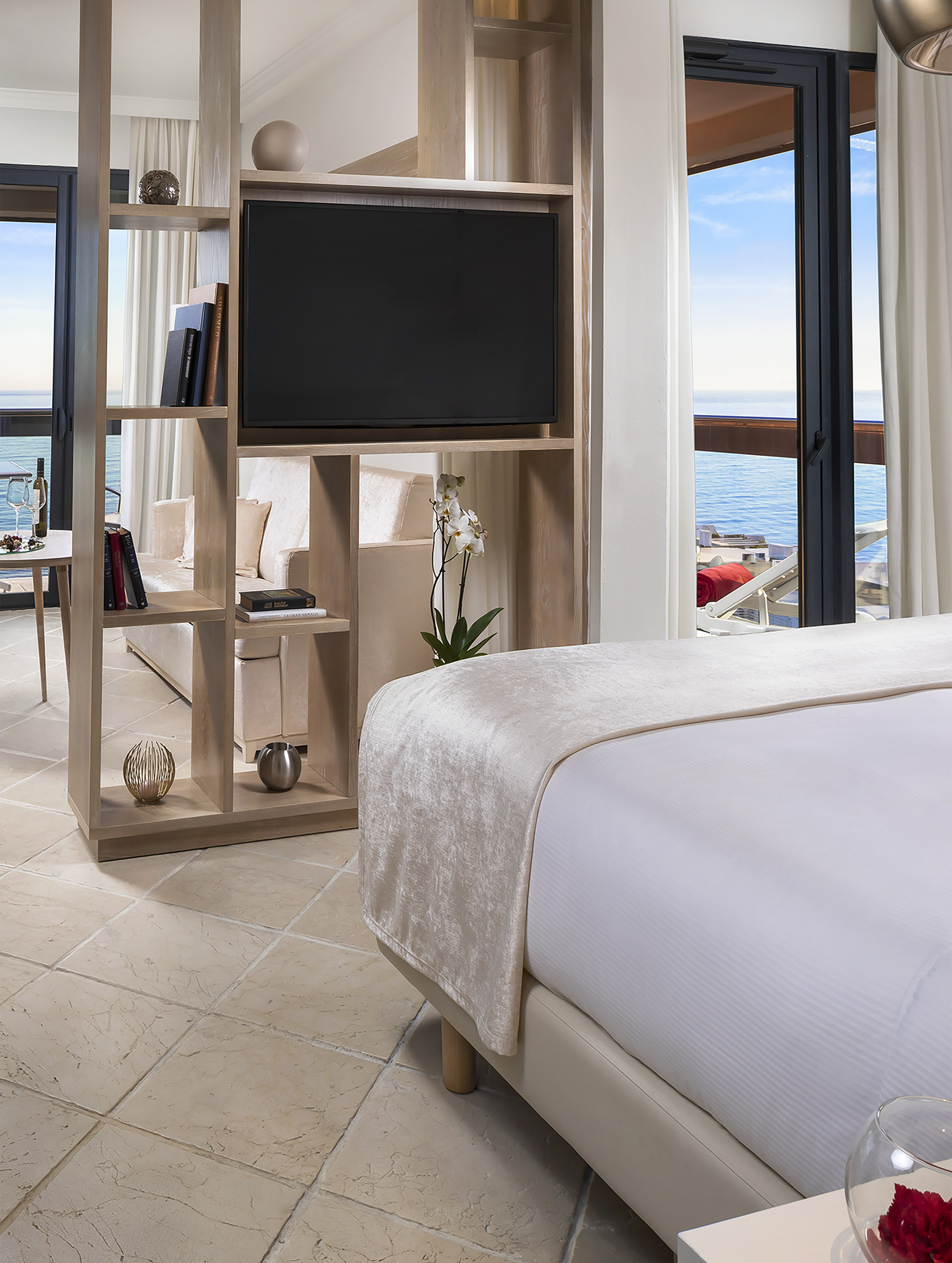 a room with a television and a bed