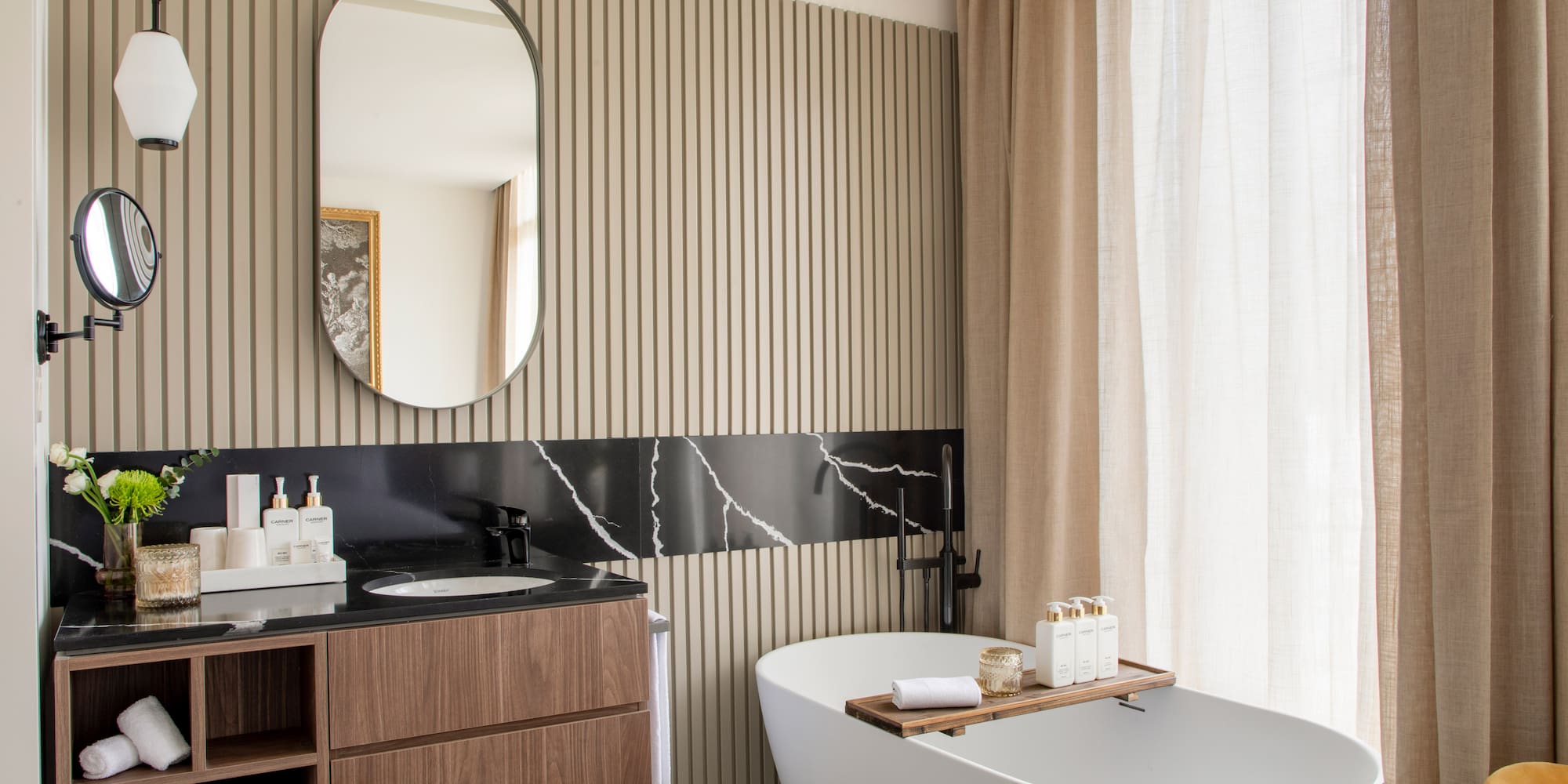 a bathroom with a tub and a mirror