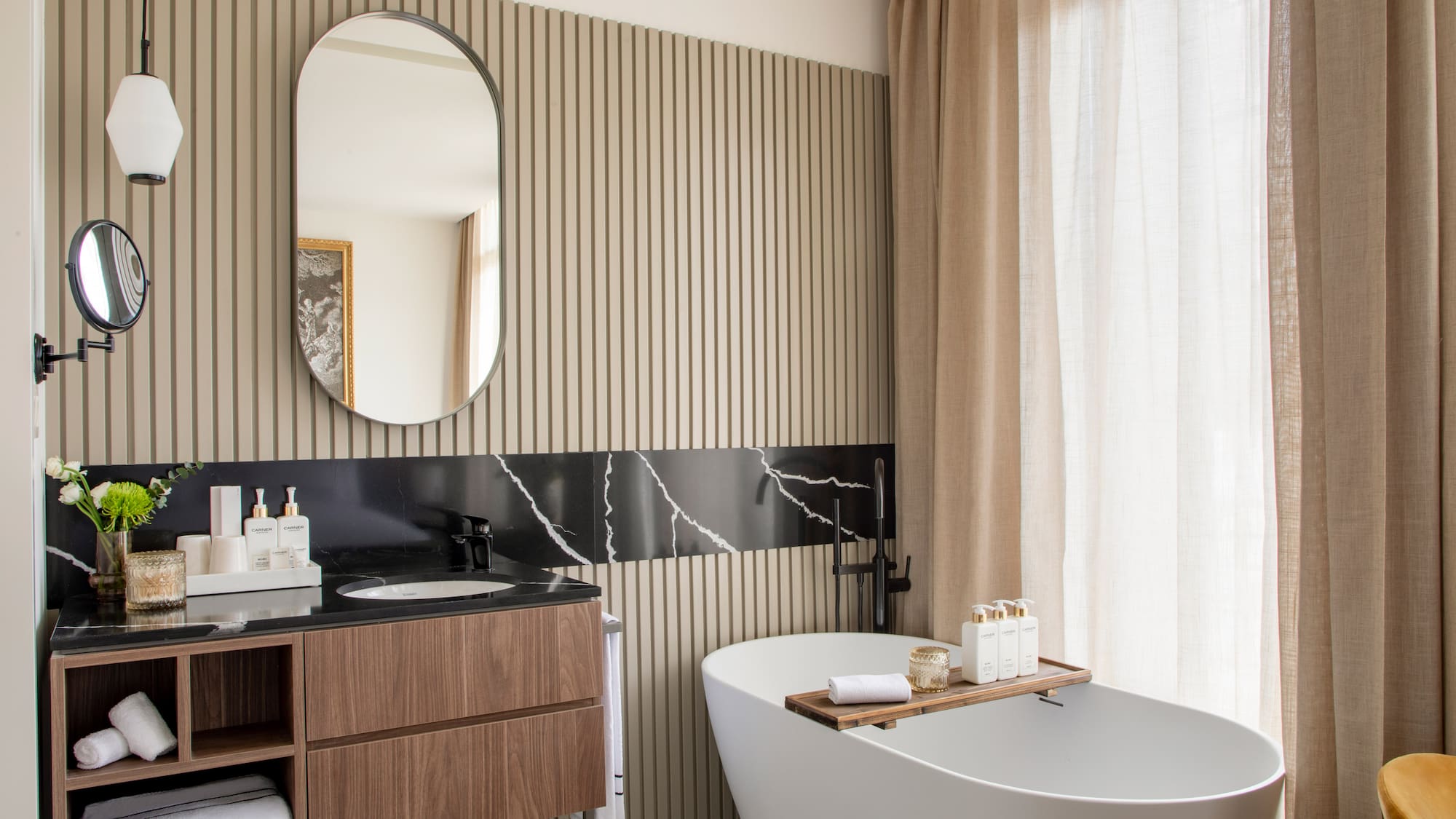 a bathroom with a tub and a mirror