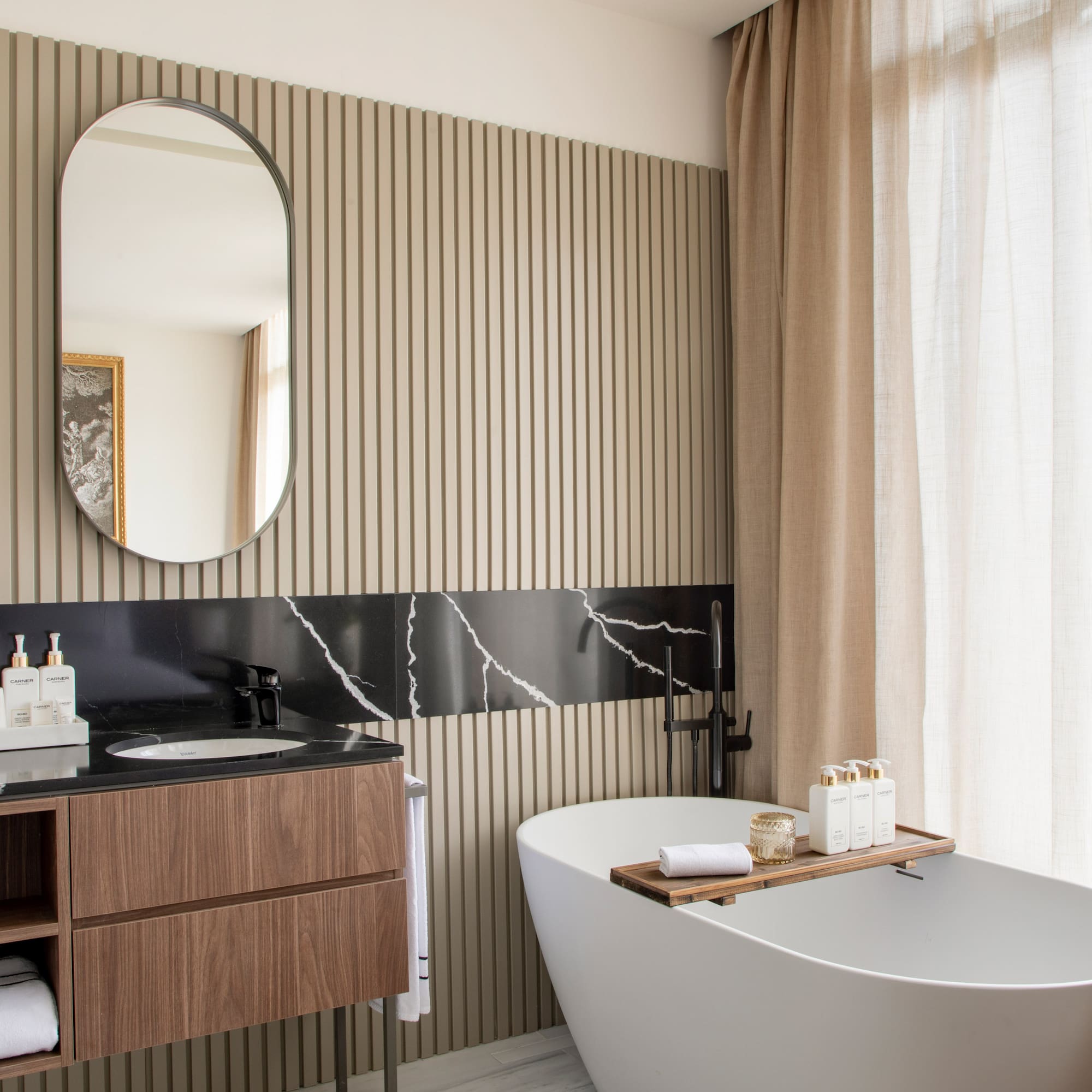 a bathroom with a tub and a mirror
