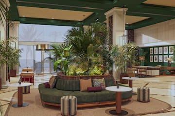 a room with a couch and plants