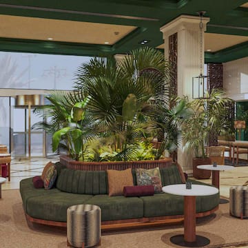 a room with a couch and plants
