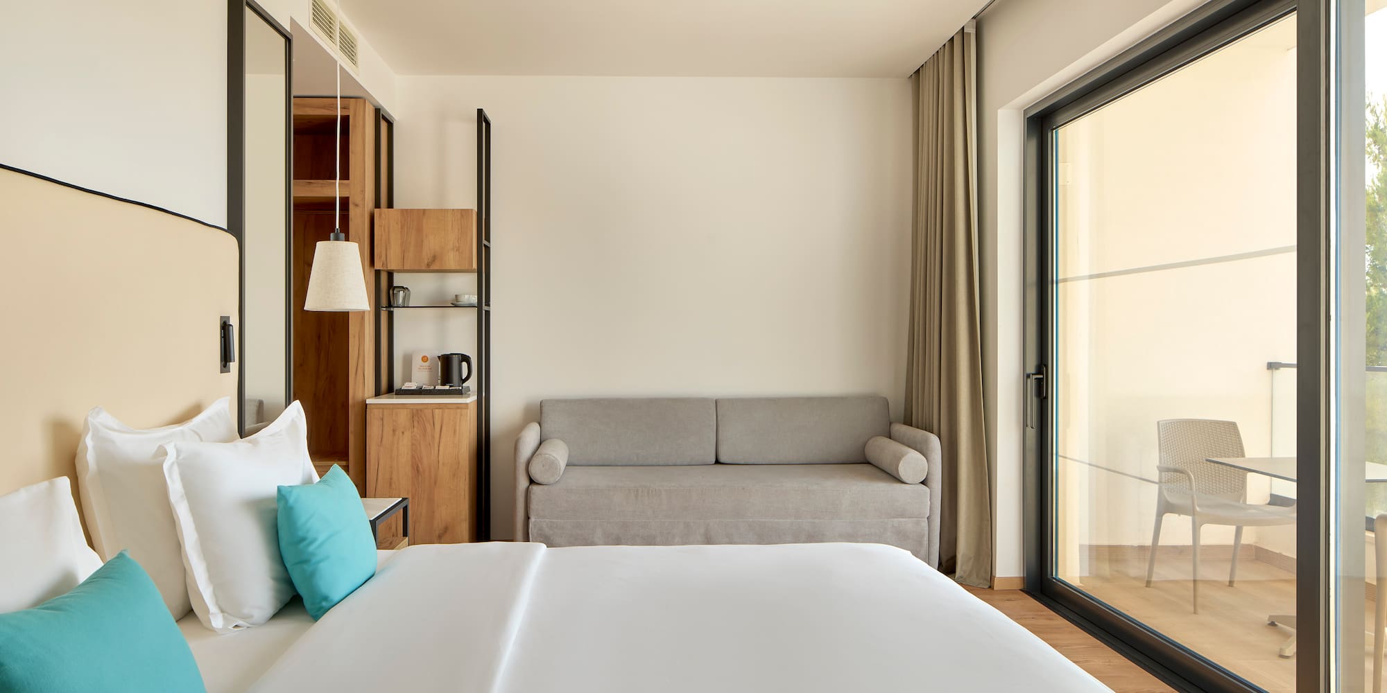 a bedroom with a bed and a couch