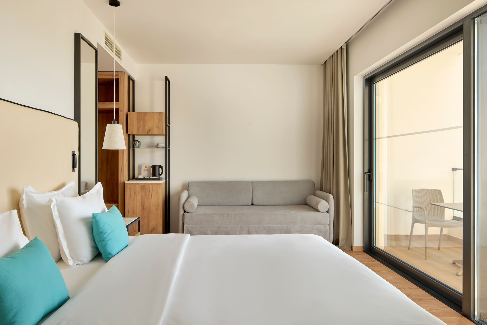 a bedroom with a bed and a couch