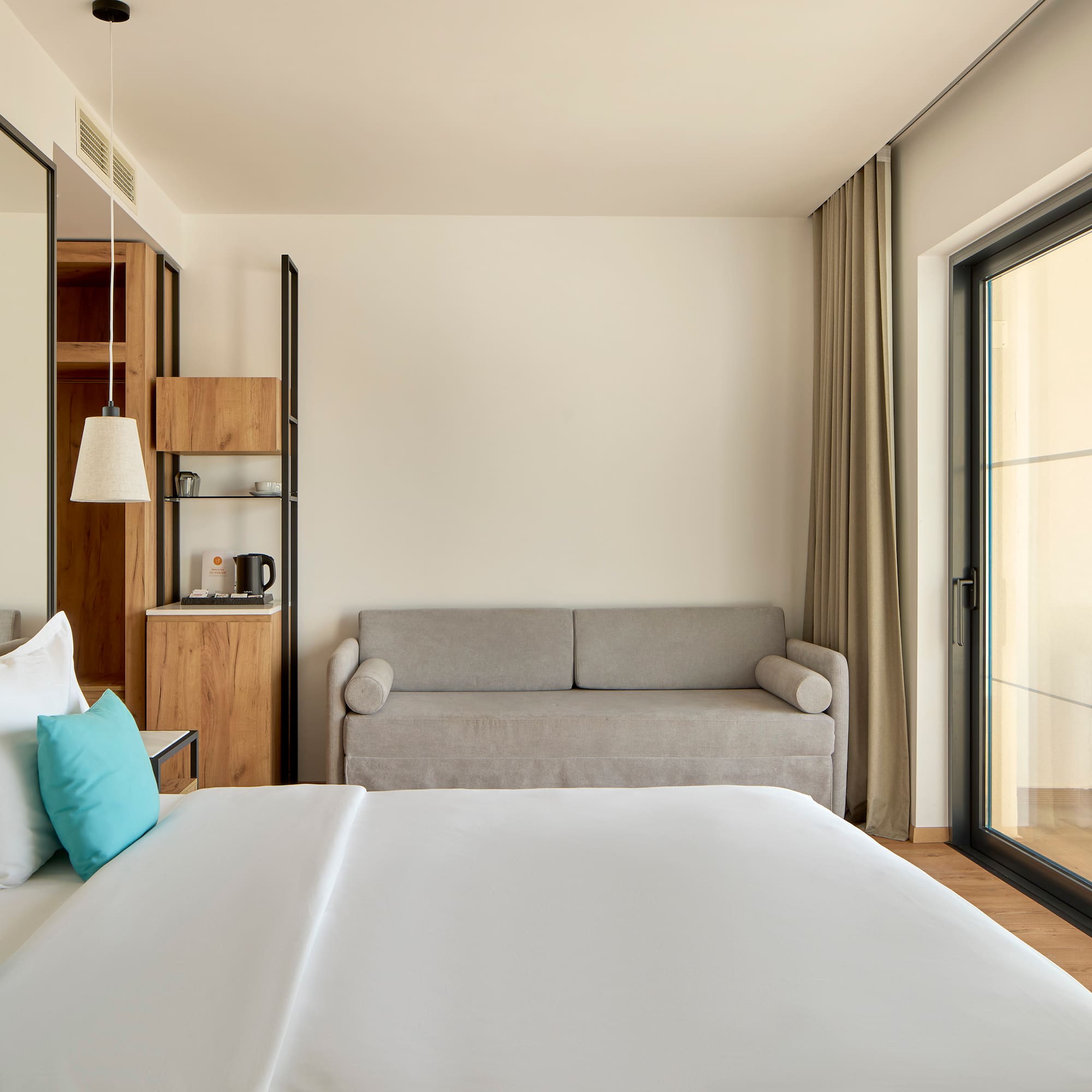 a bedroom with a bed and a couch