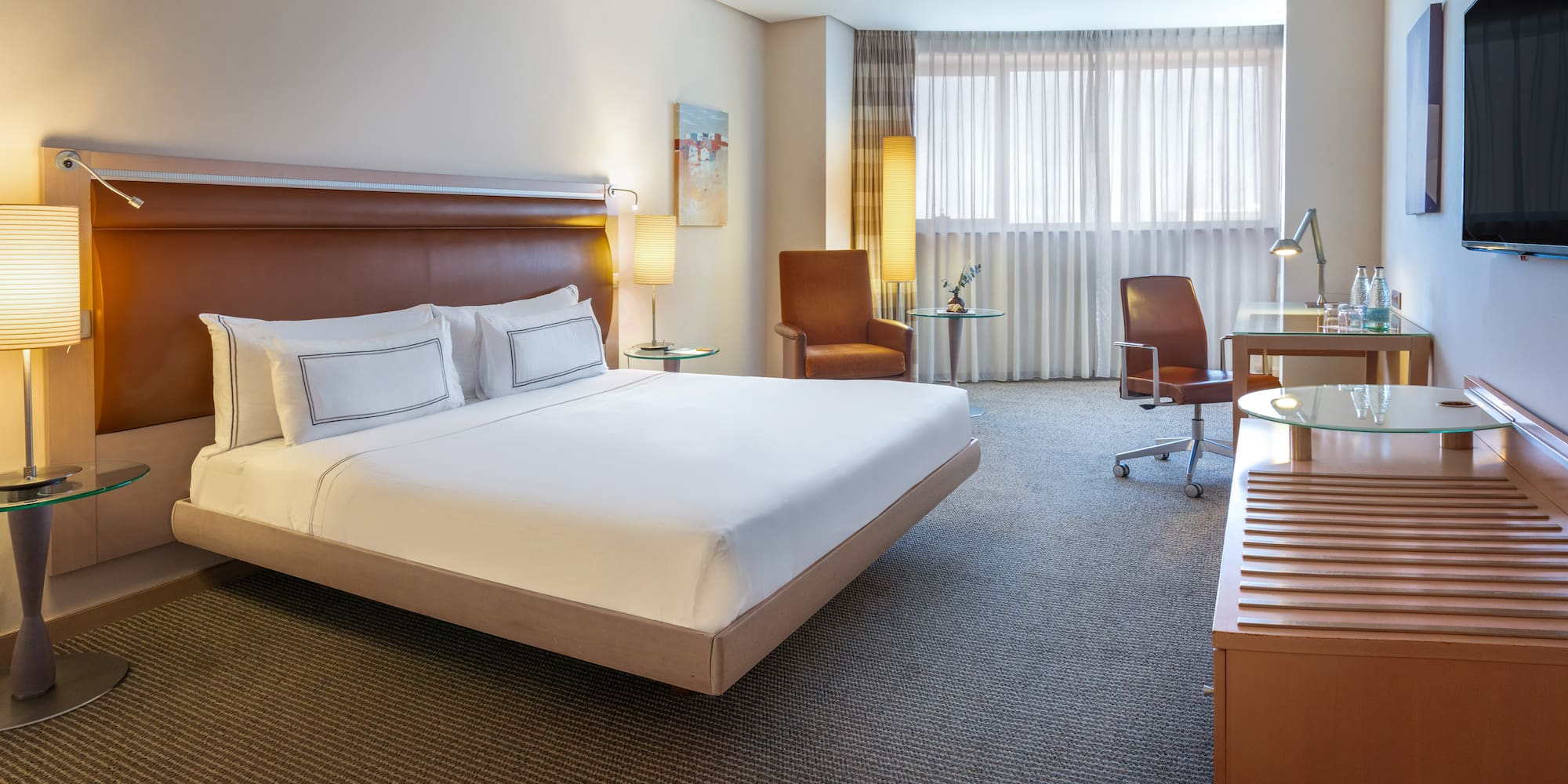 a room with a bed and a desk