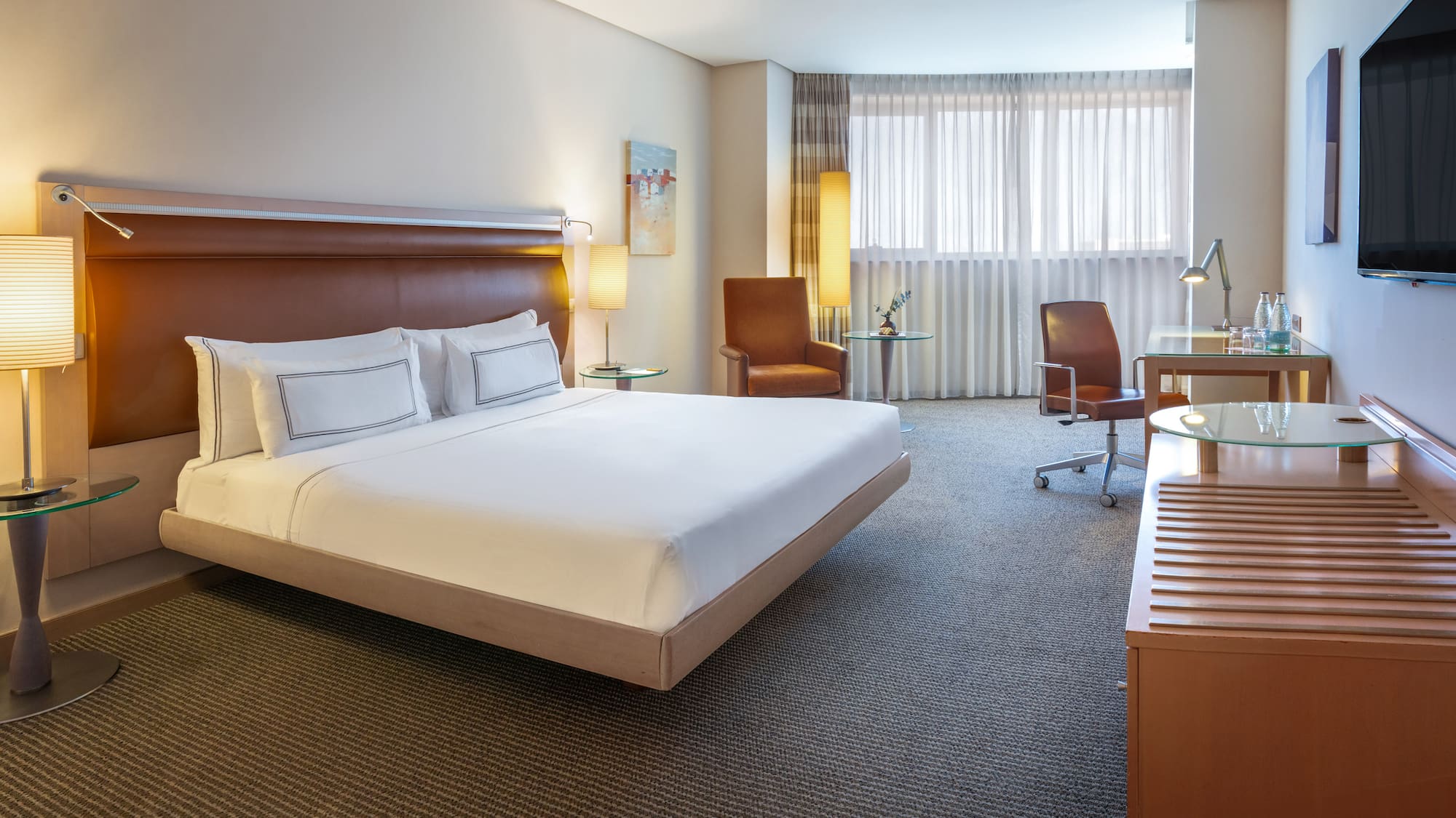 a room with a bed and a desk