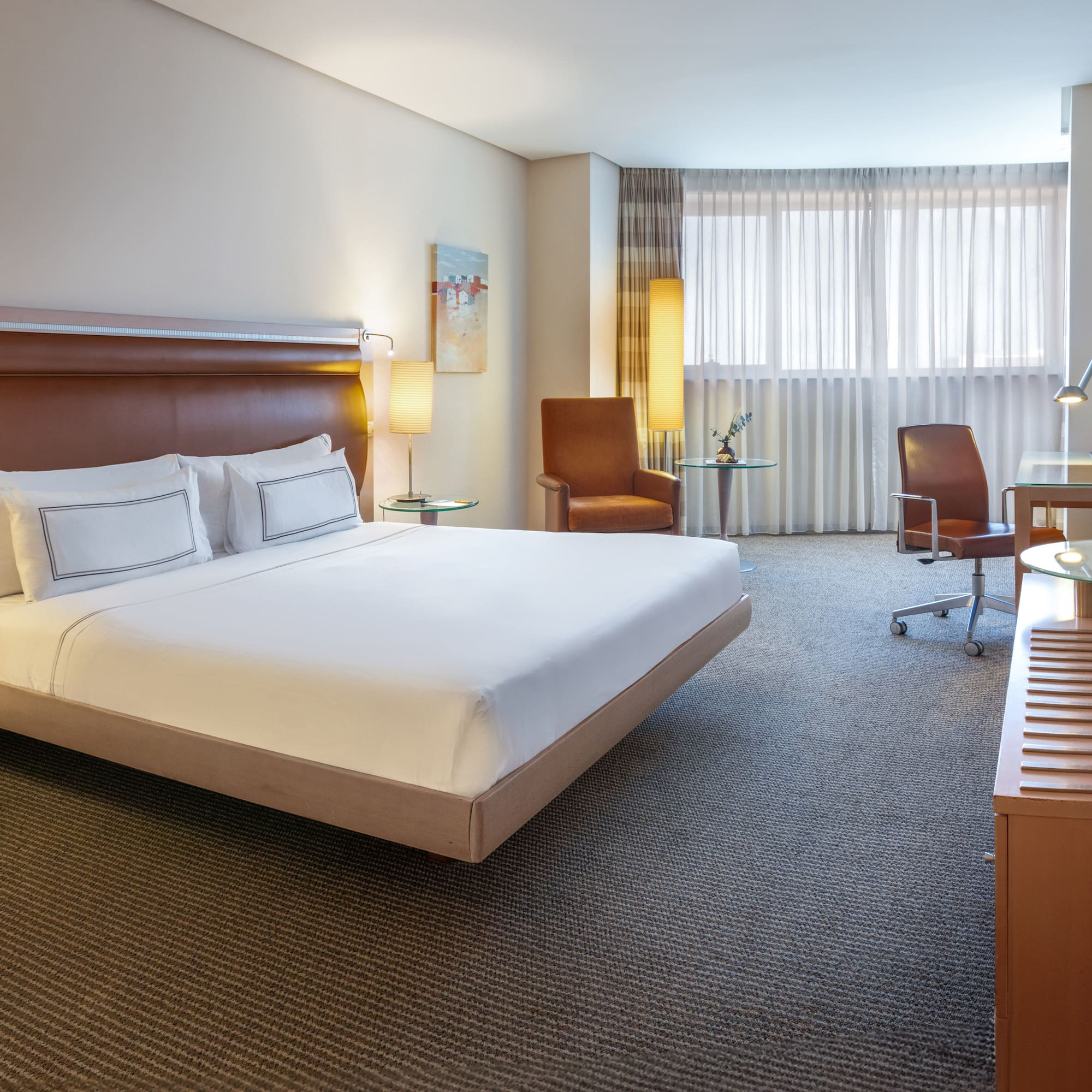 a room with a bed and a desk