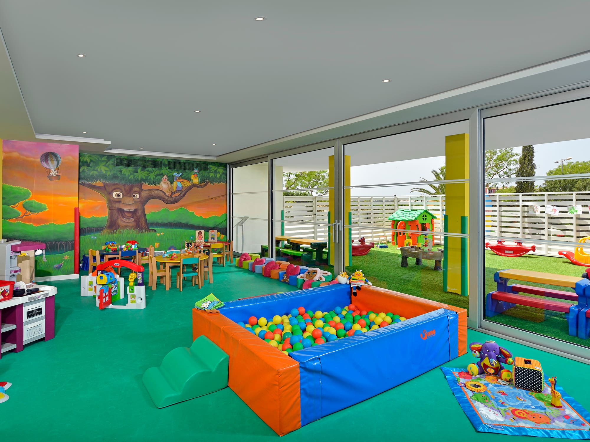 a room with a pool and toys