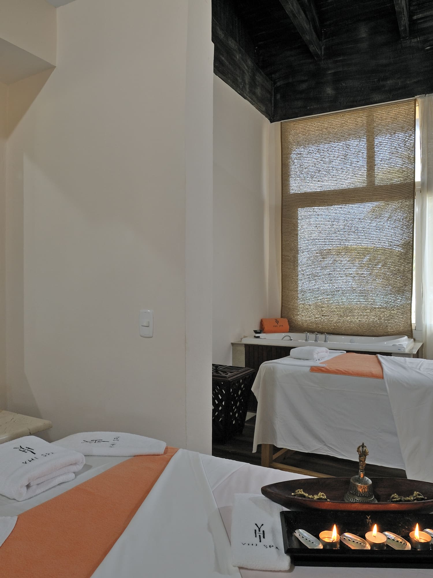 a room with beds and towels