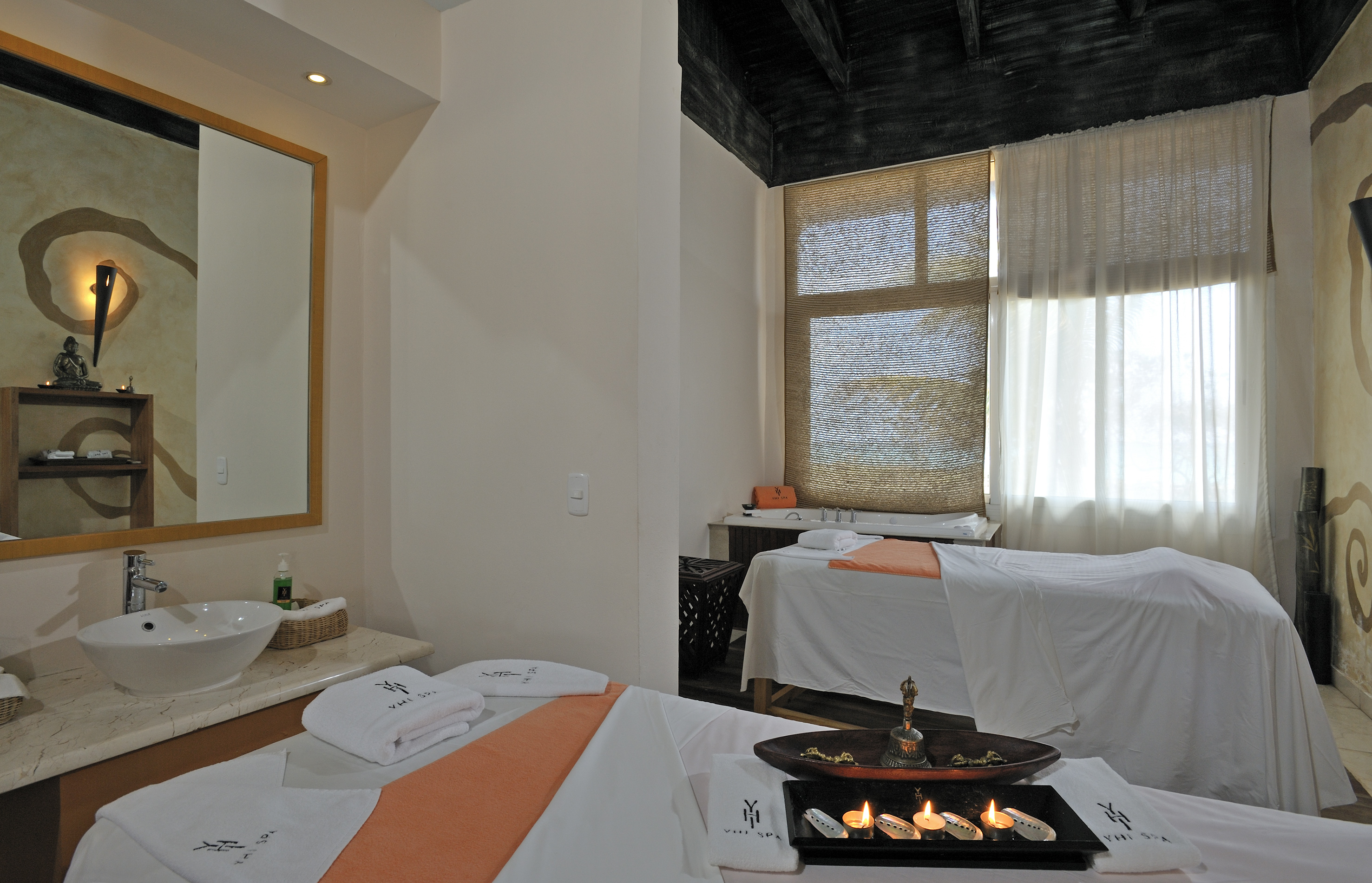 a room with beds and towels