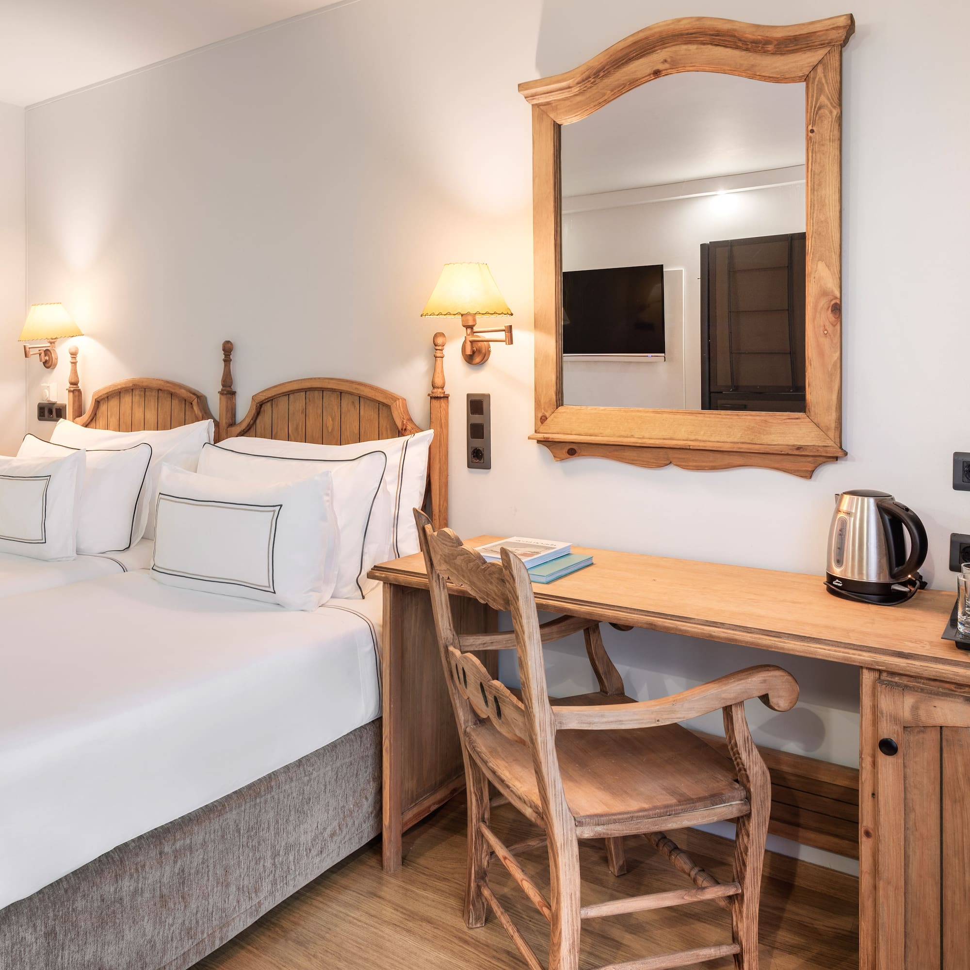 a room with a bed and a desk