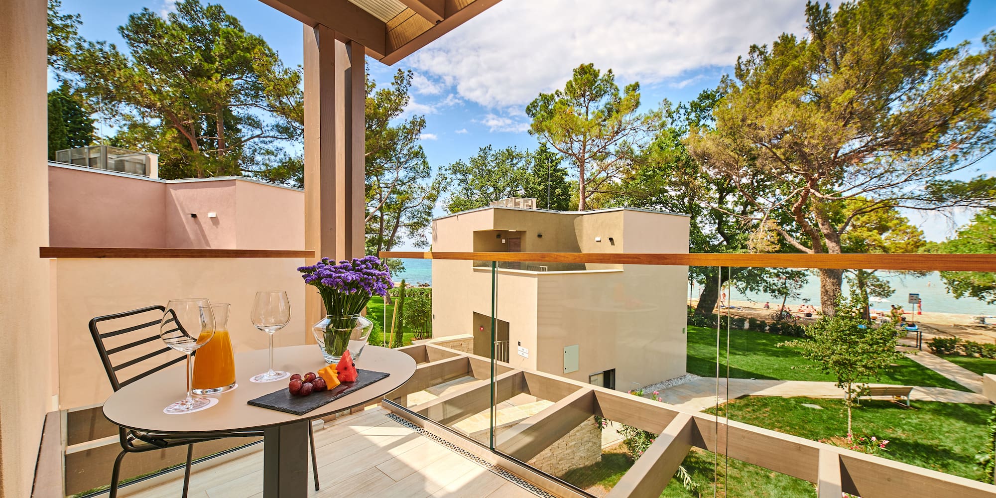 a table with food and glasses on it outside