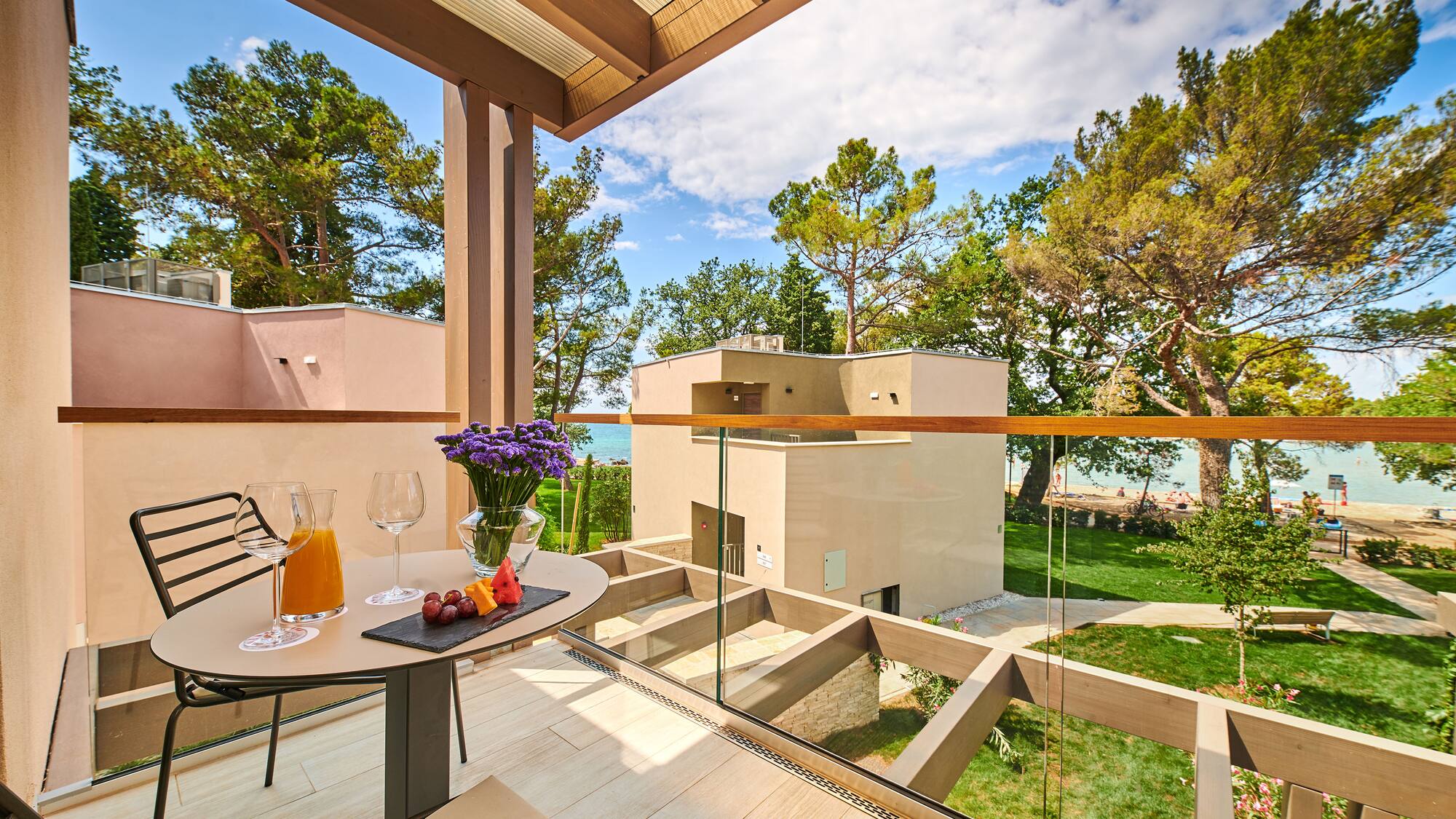 a table with food and glasses on it outside