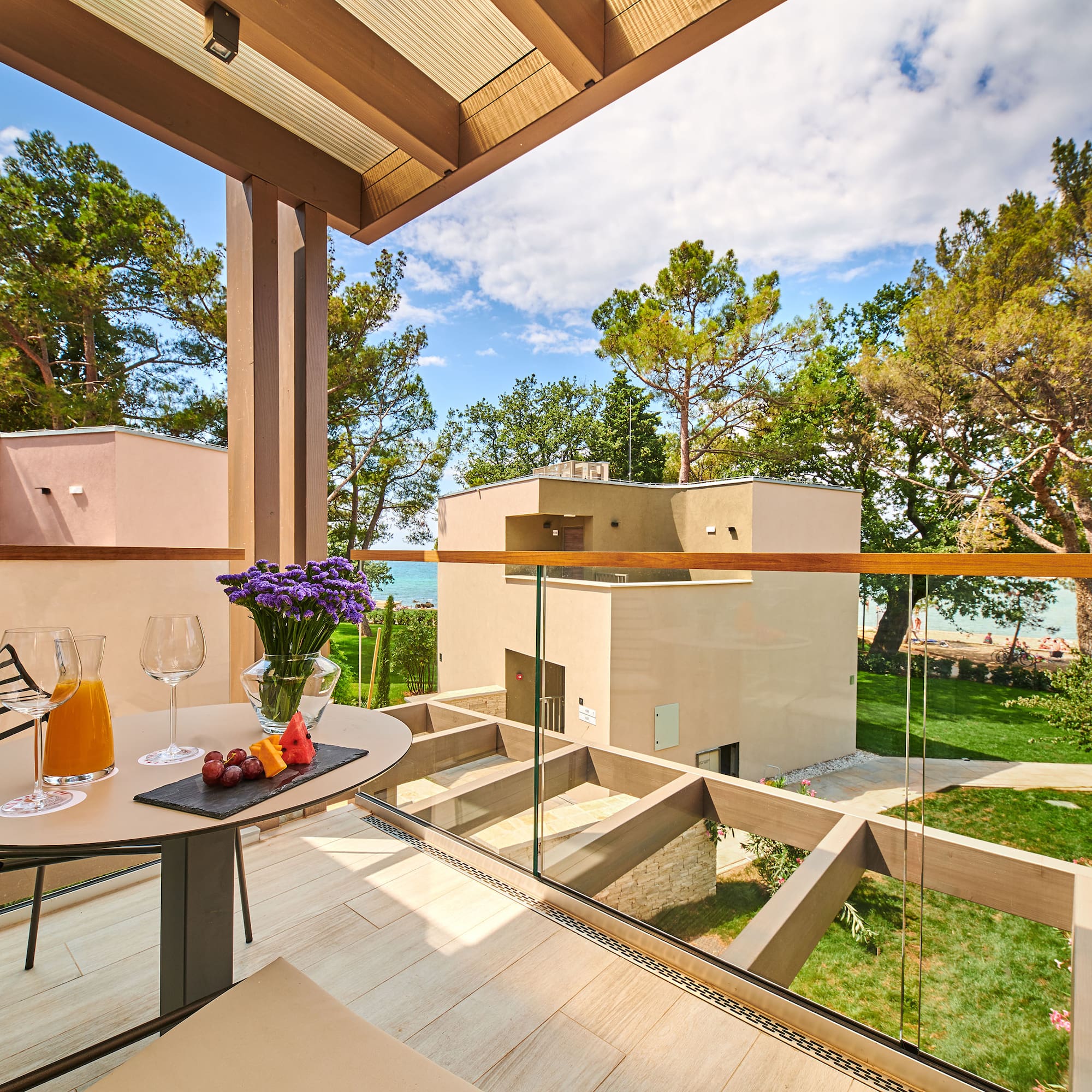a table with food and glasses on it outside