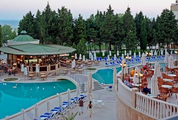 a pool with people sitting around it