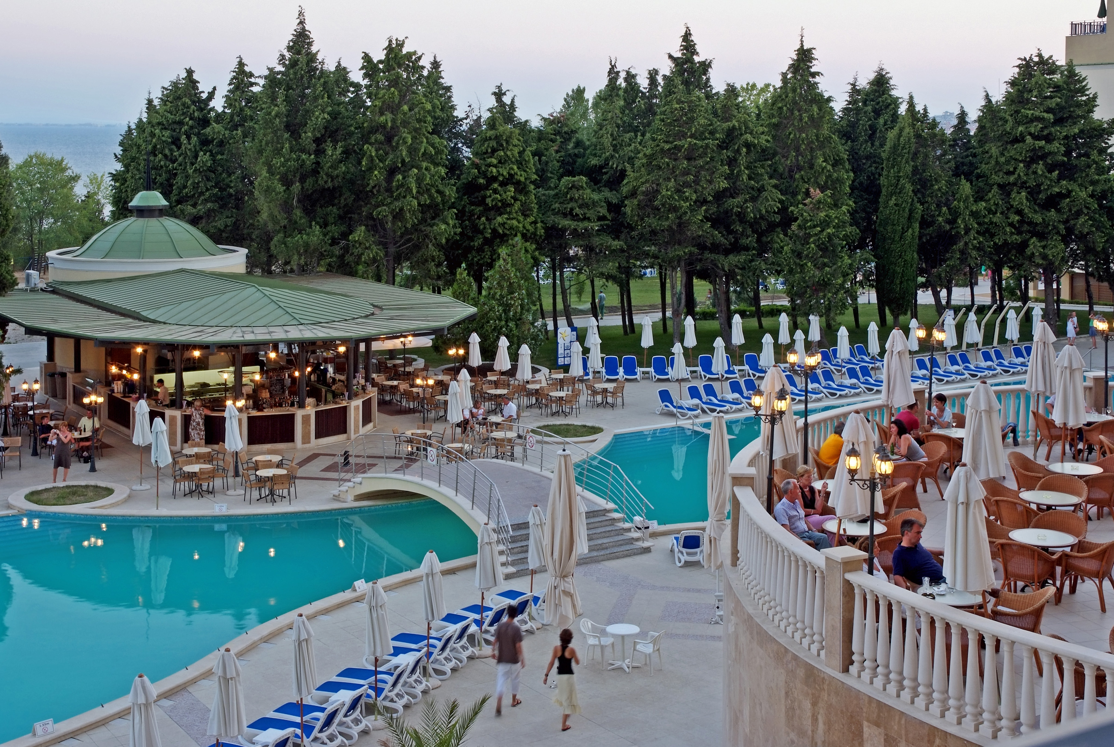 a pool with people sitting around it