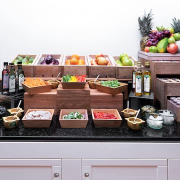 a counter with different fruits and vegetables