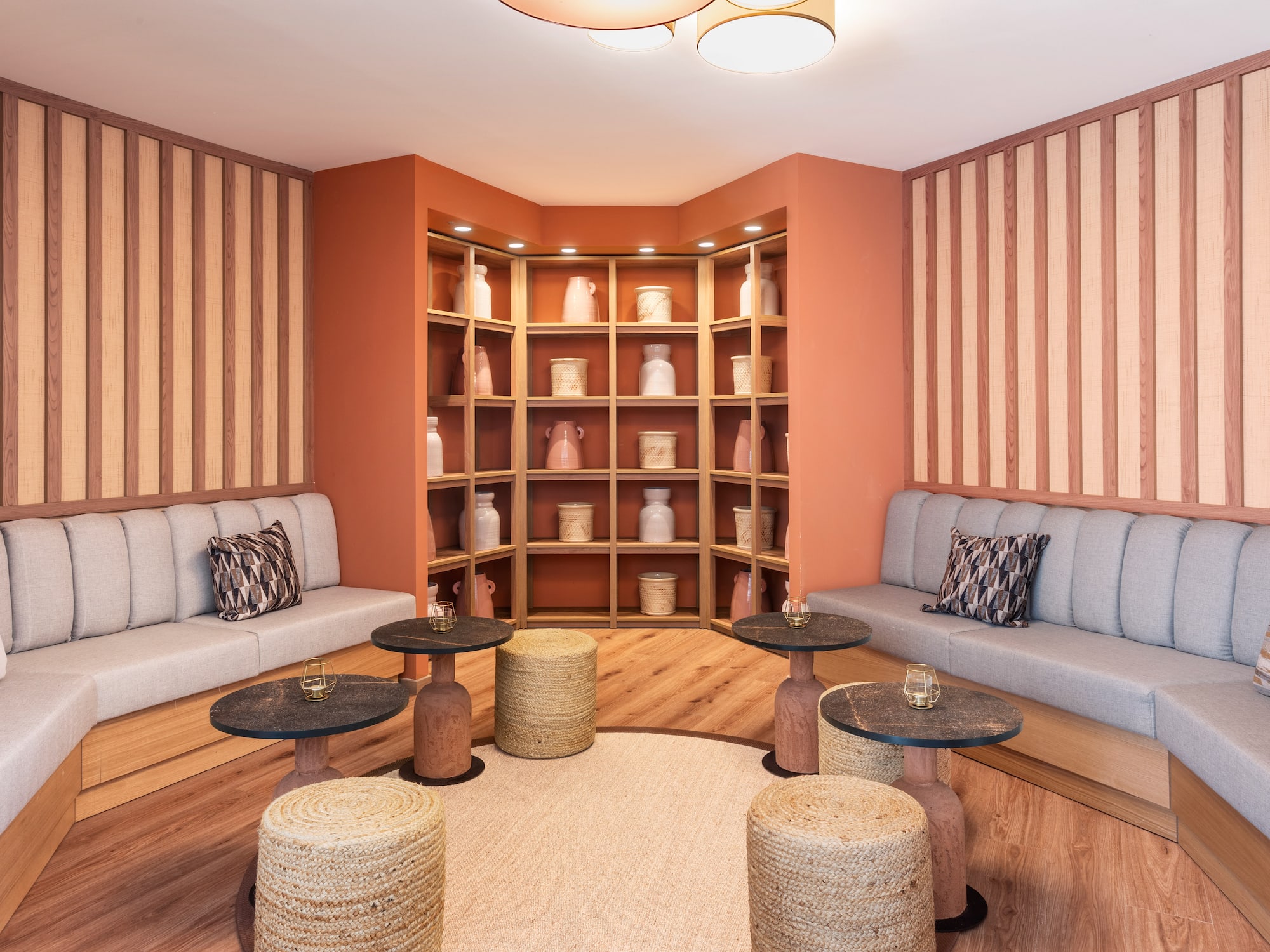 a room with a couch and tables