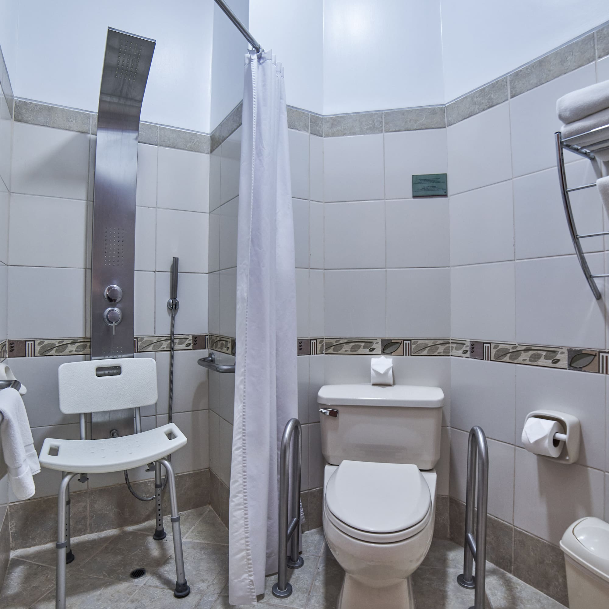 a bathroom with a shower curtain and toilet