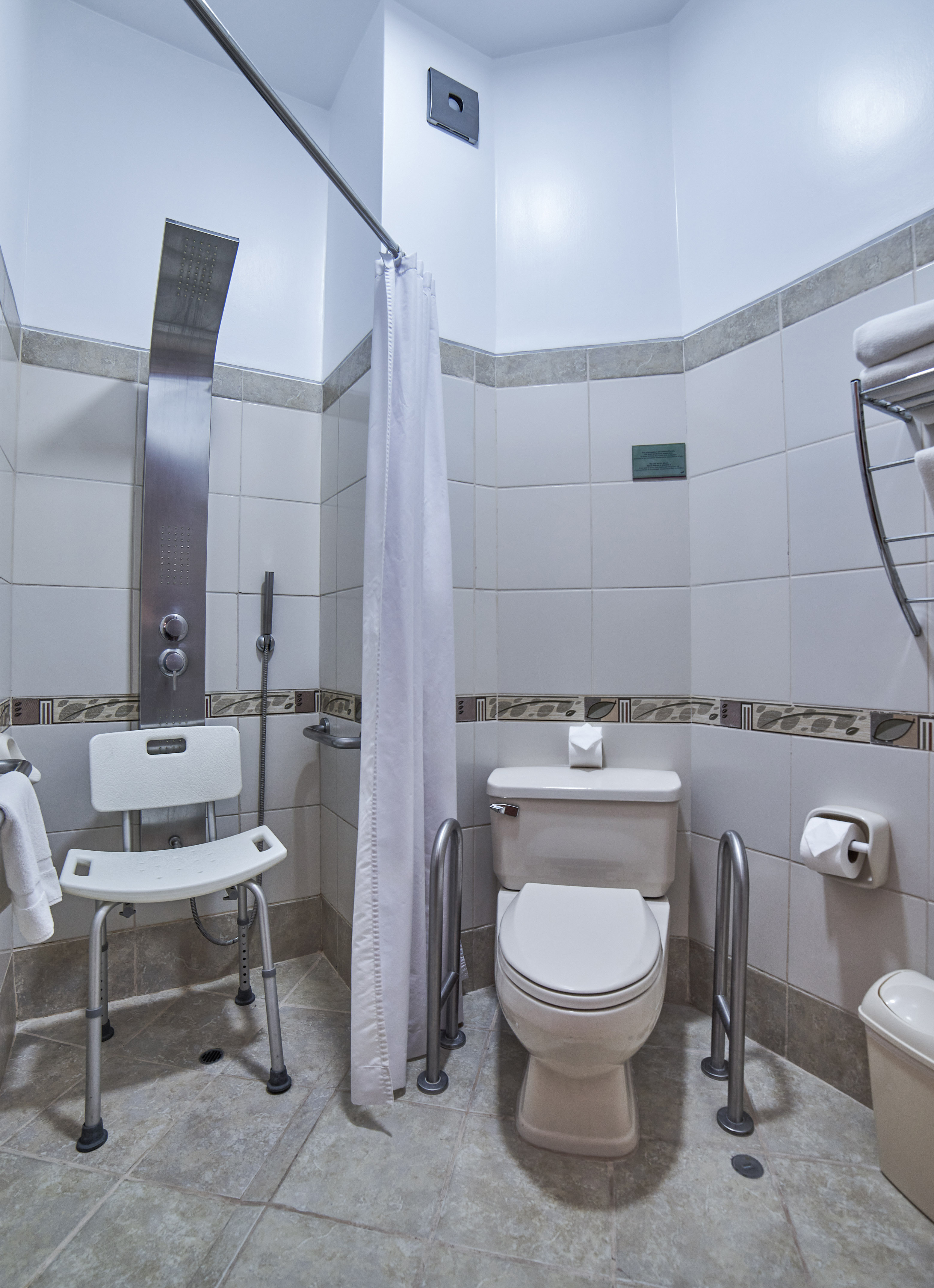 a bathroom with a shower curtain and toilet