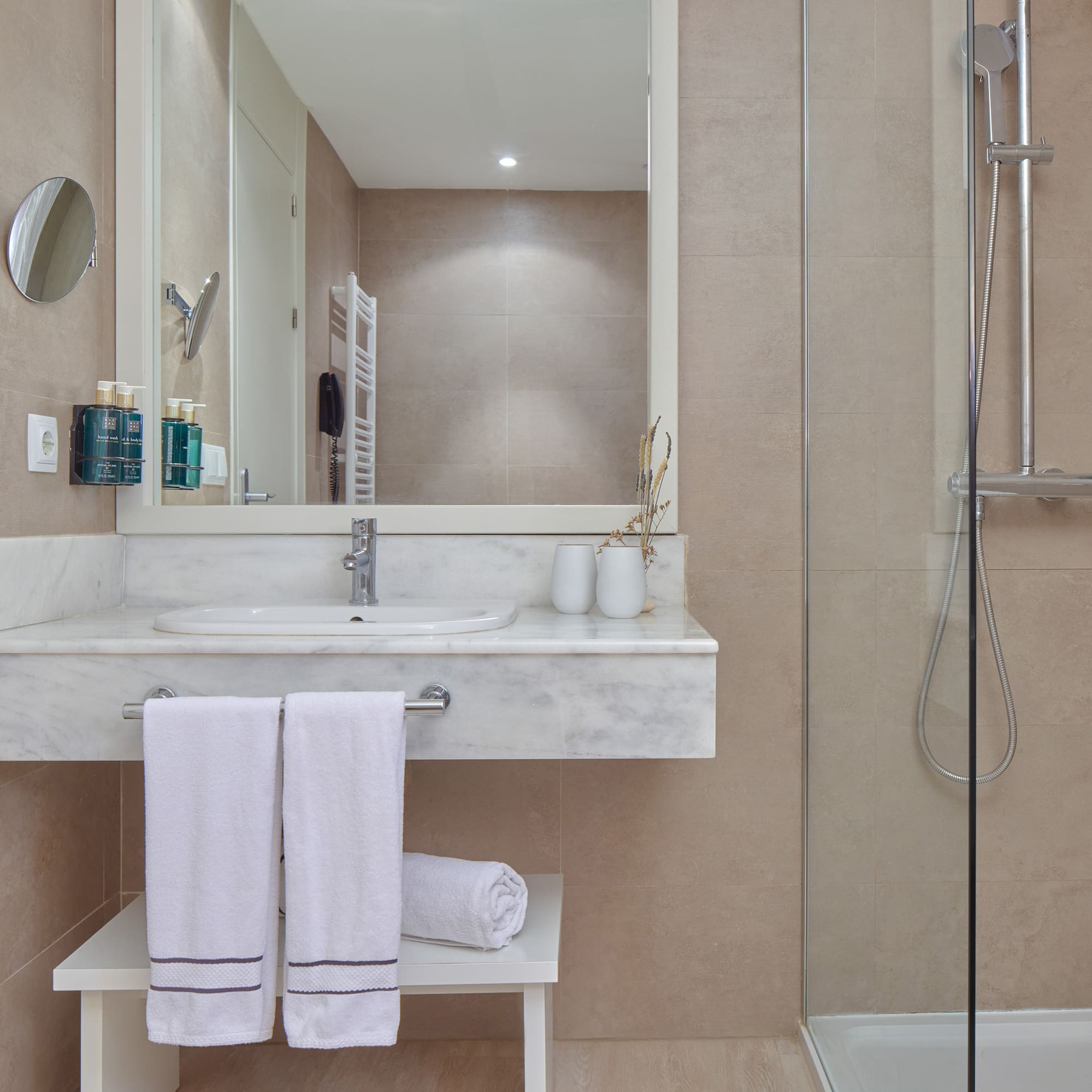 a bathroom with a shower and a sink