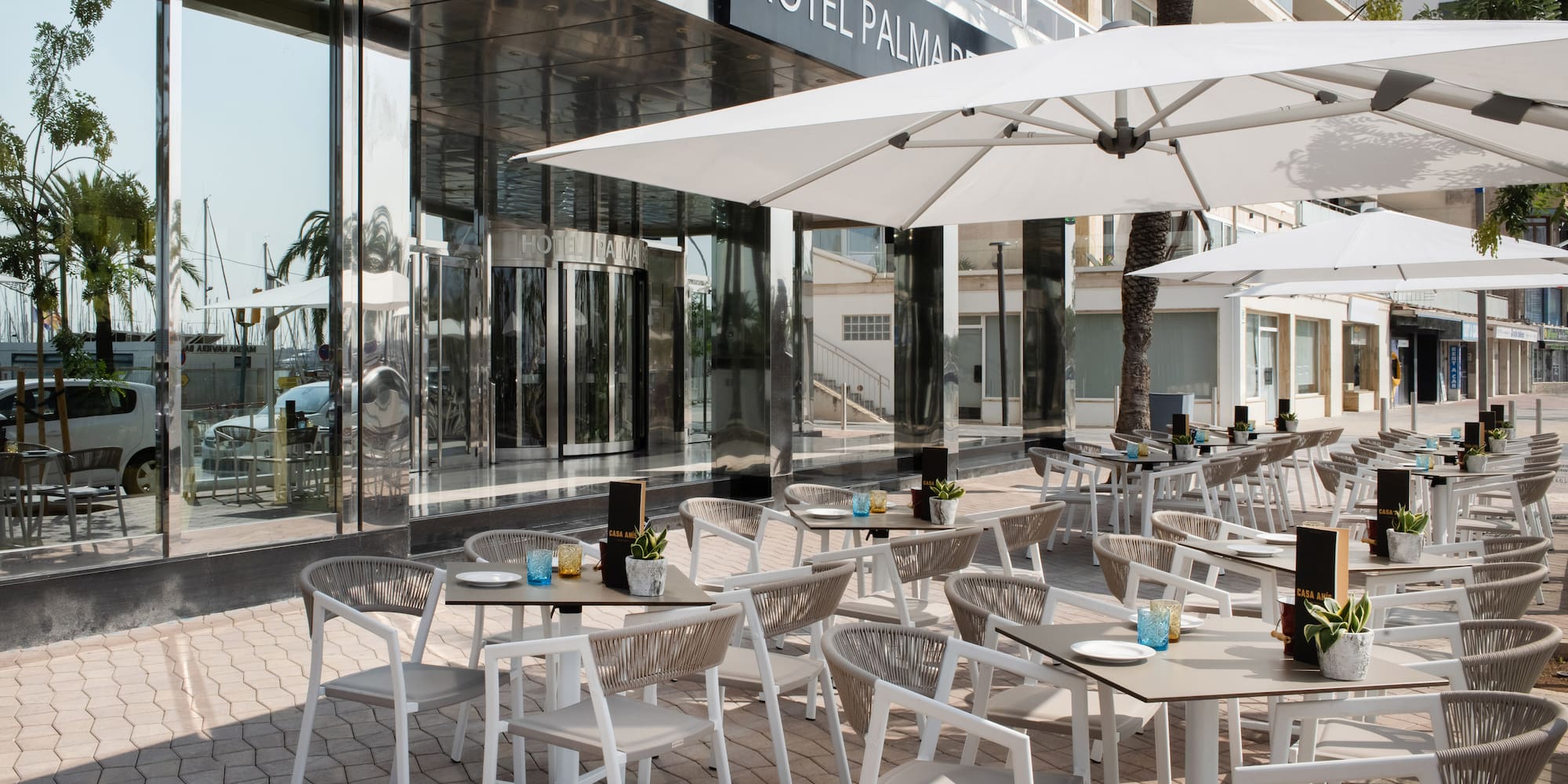 a tables and chairs outside of a hotel