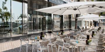 a tables and chairs outside of a hotel