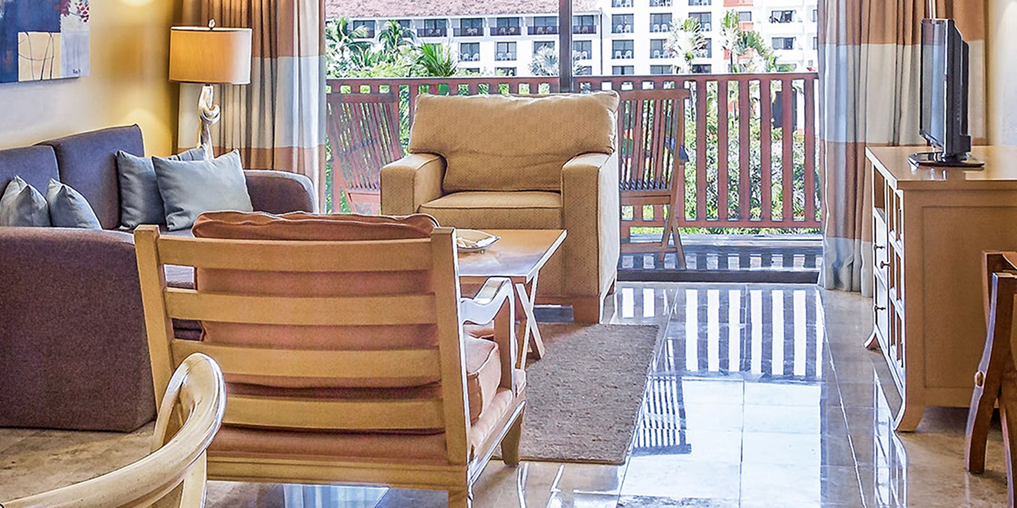 a living room with a glass door and a table