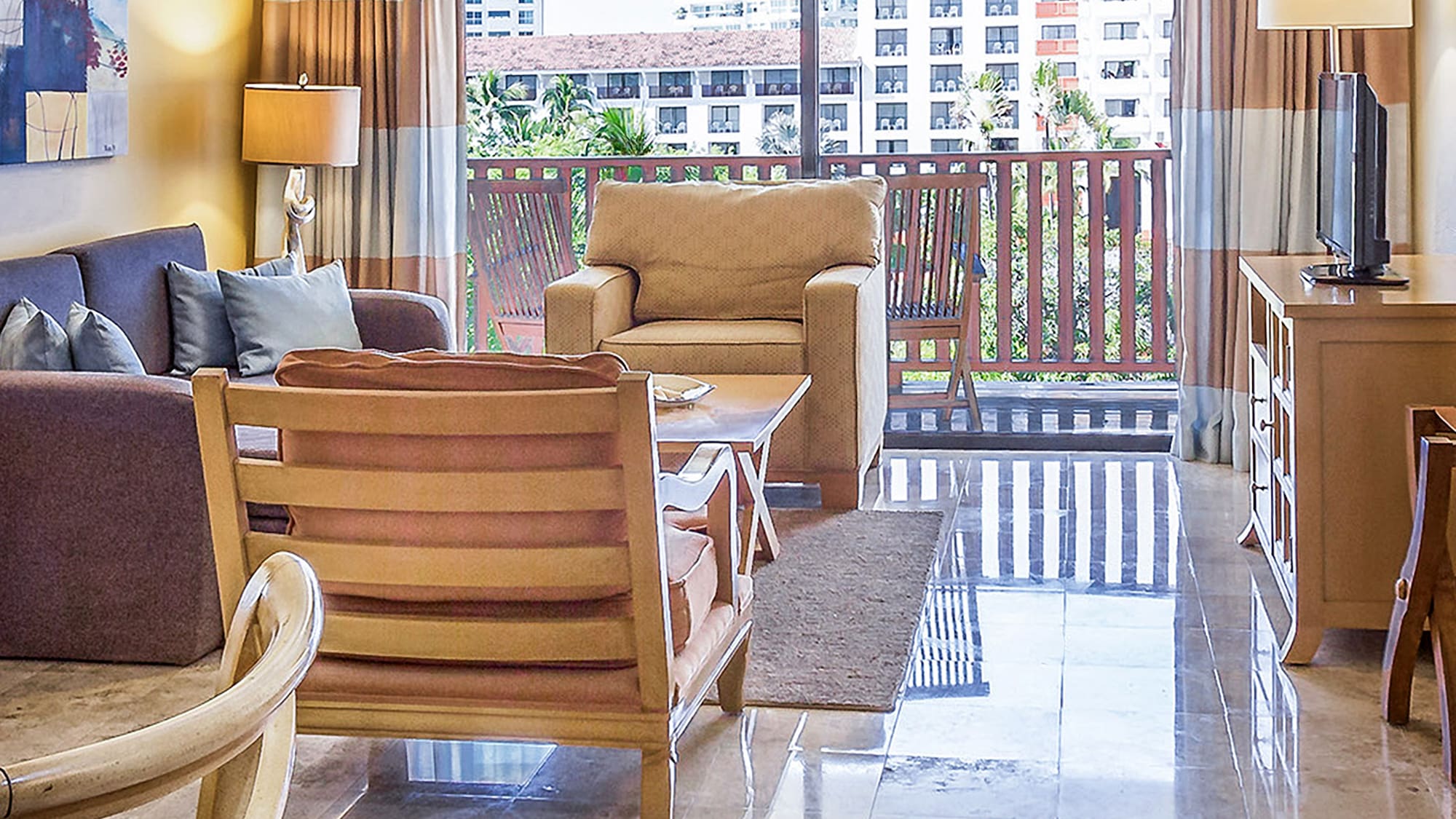 a living room with a glass door and a table