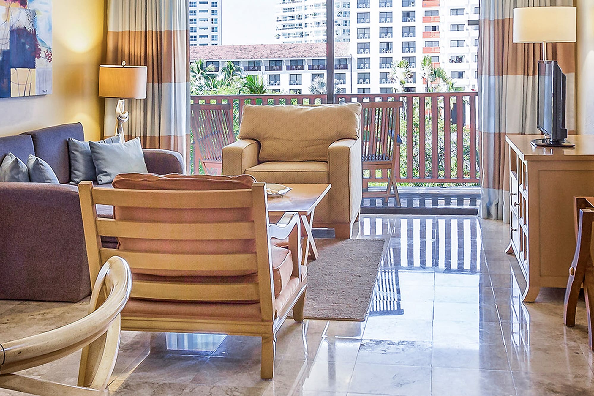 a living room with a glass door and a table