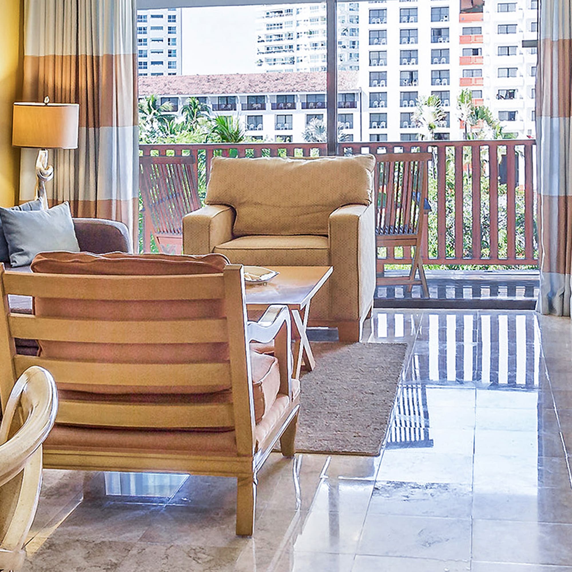 a living room with a glass door and a table
