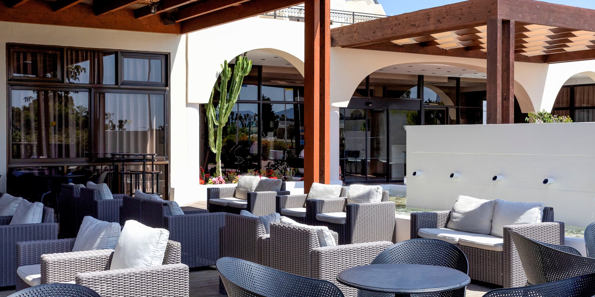 a patio with chairs and tables