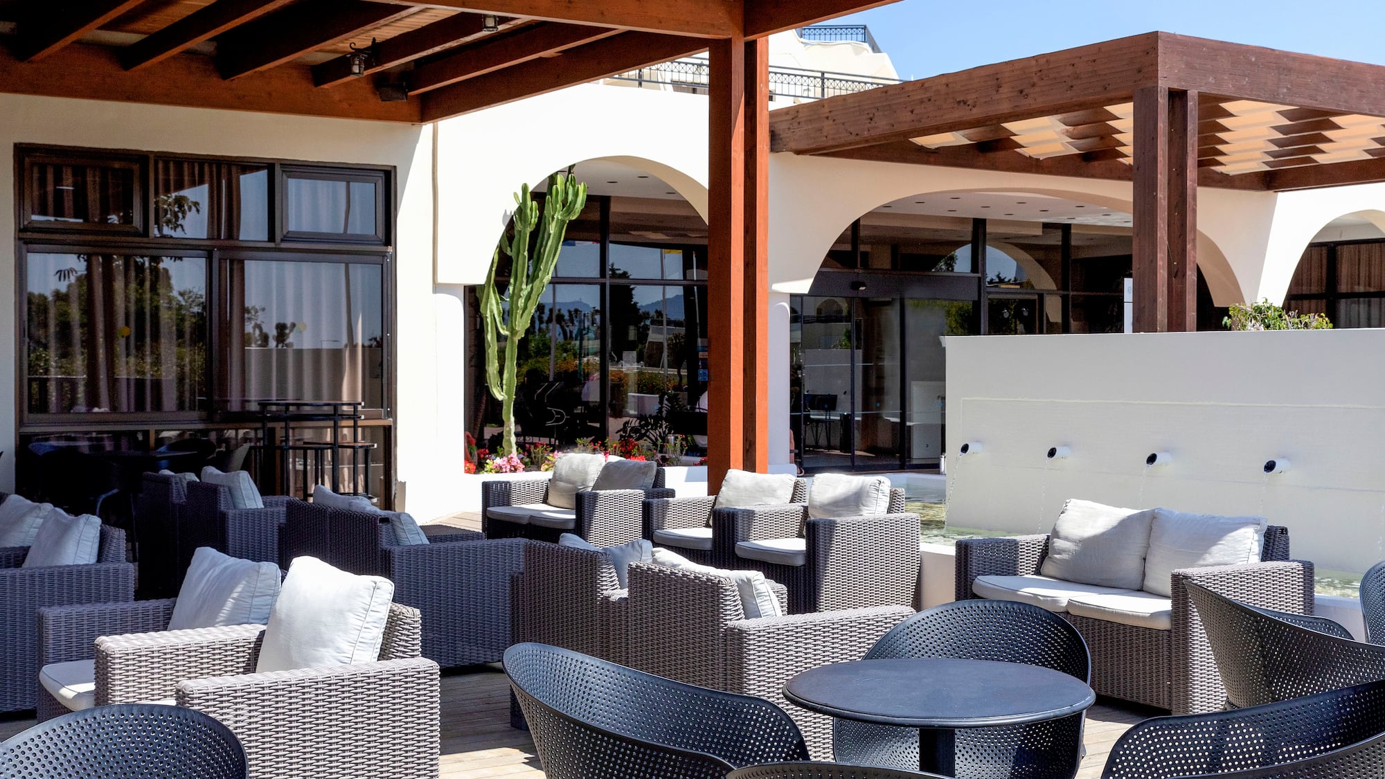 a patio with chairs and tables