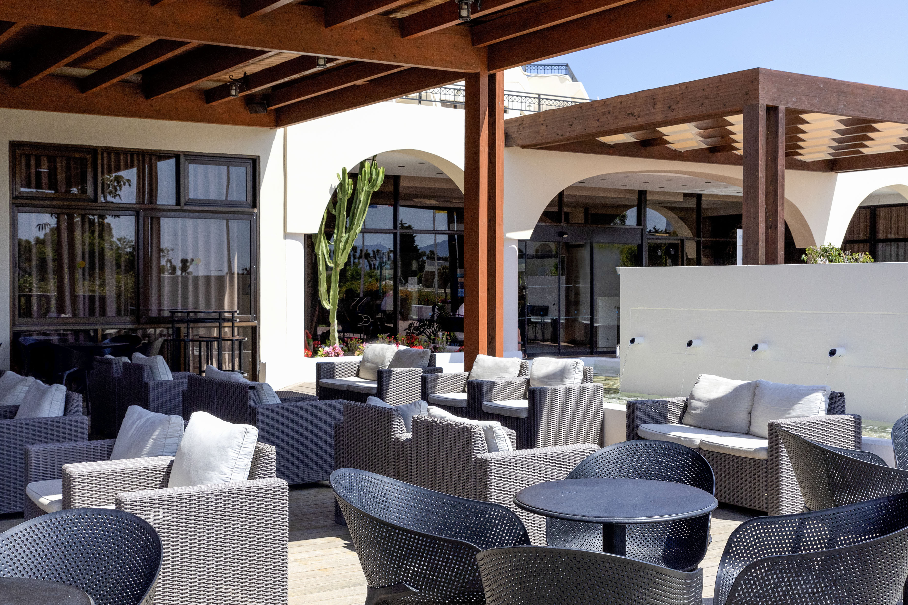 a patio with chairs and tables
