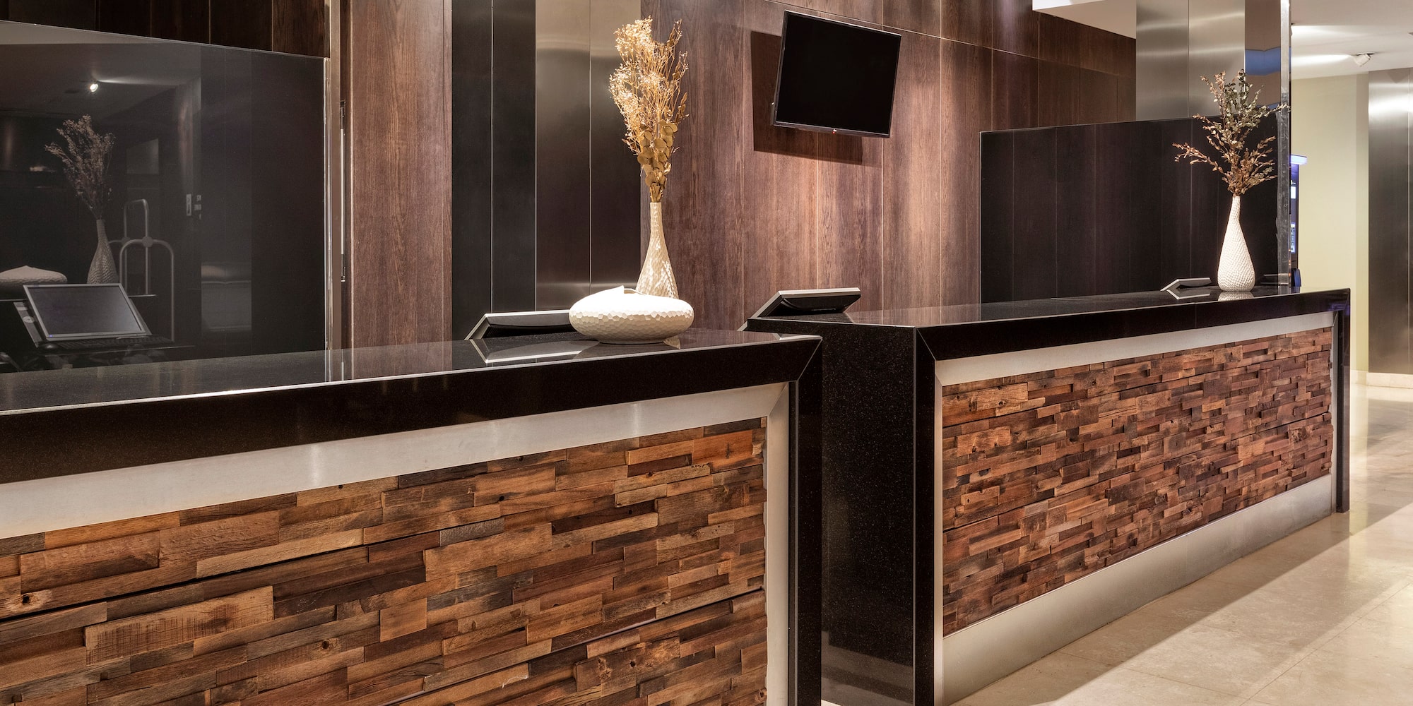a woman standing at a reception desk
