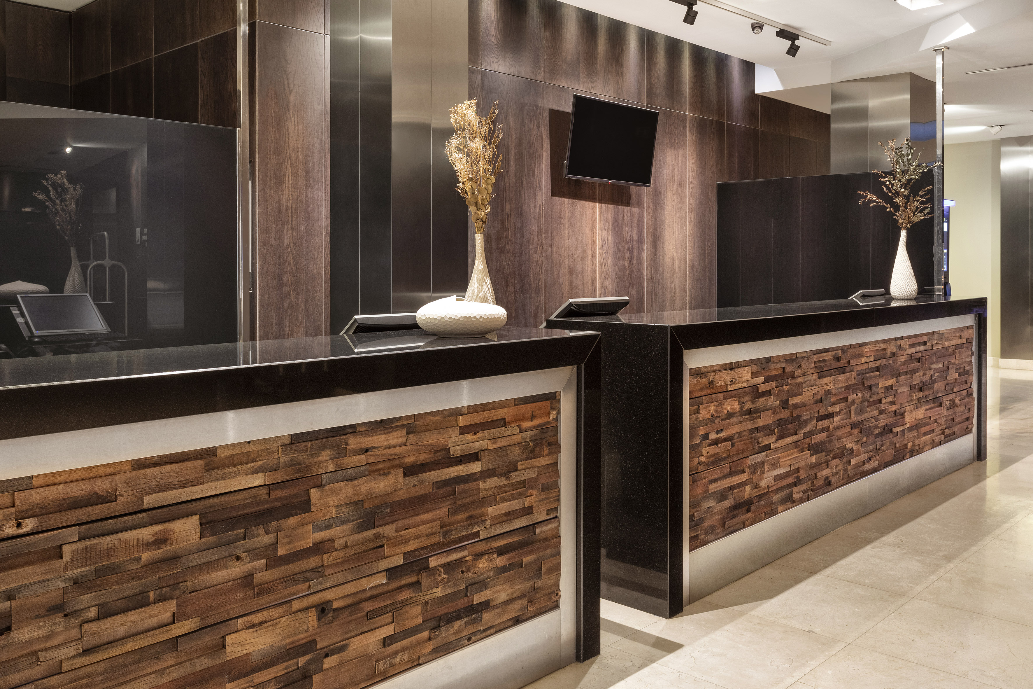 a woman standing at a reception desk