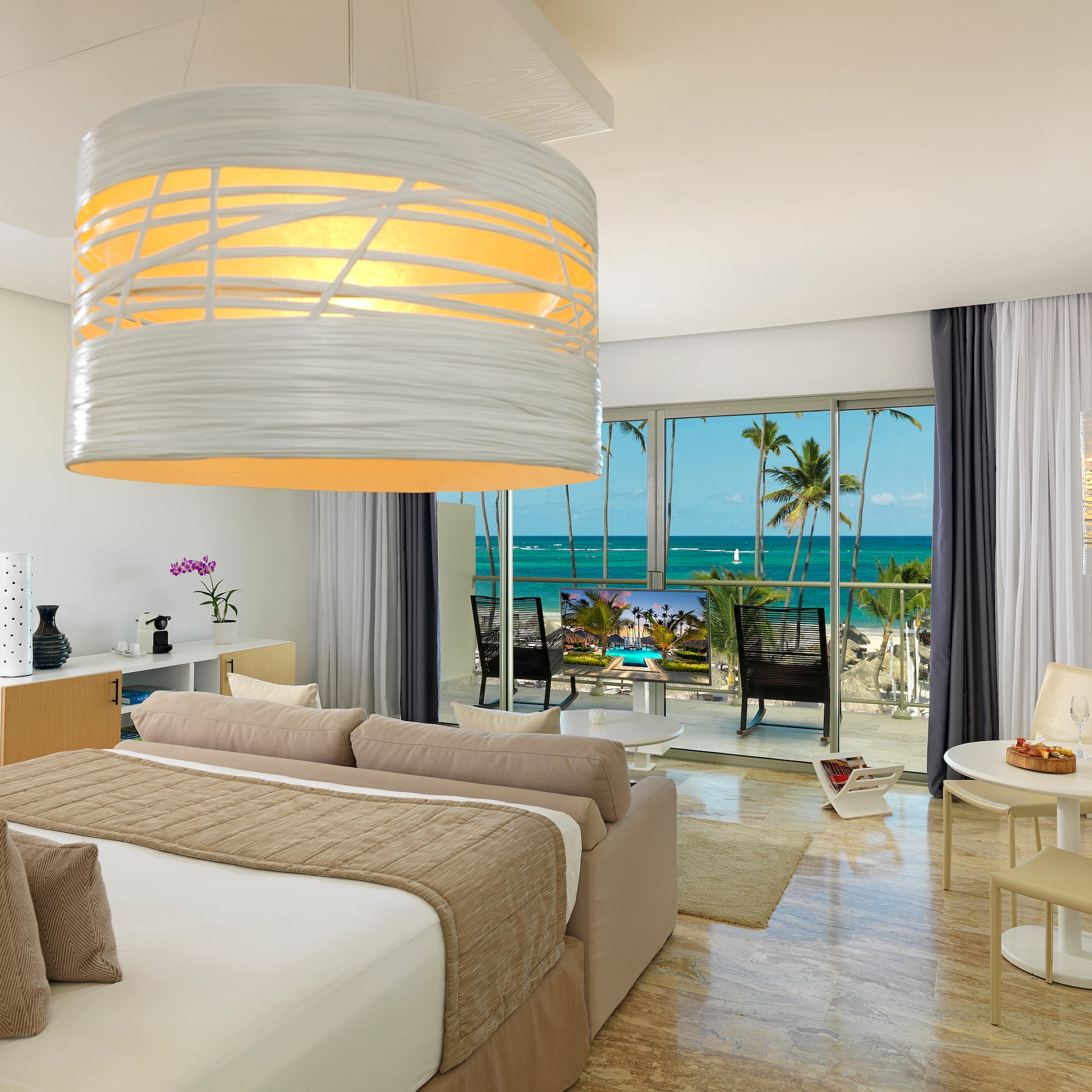 a room with a bed and a large chandelier over it